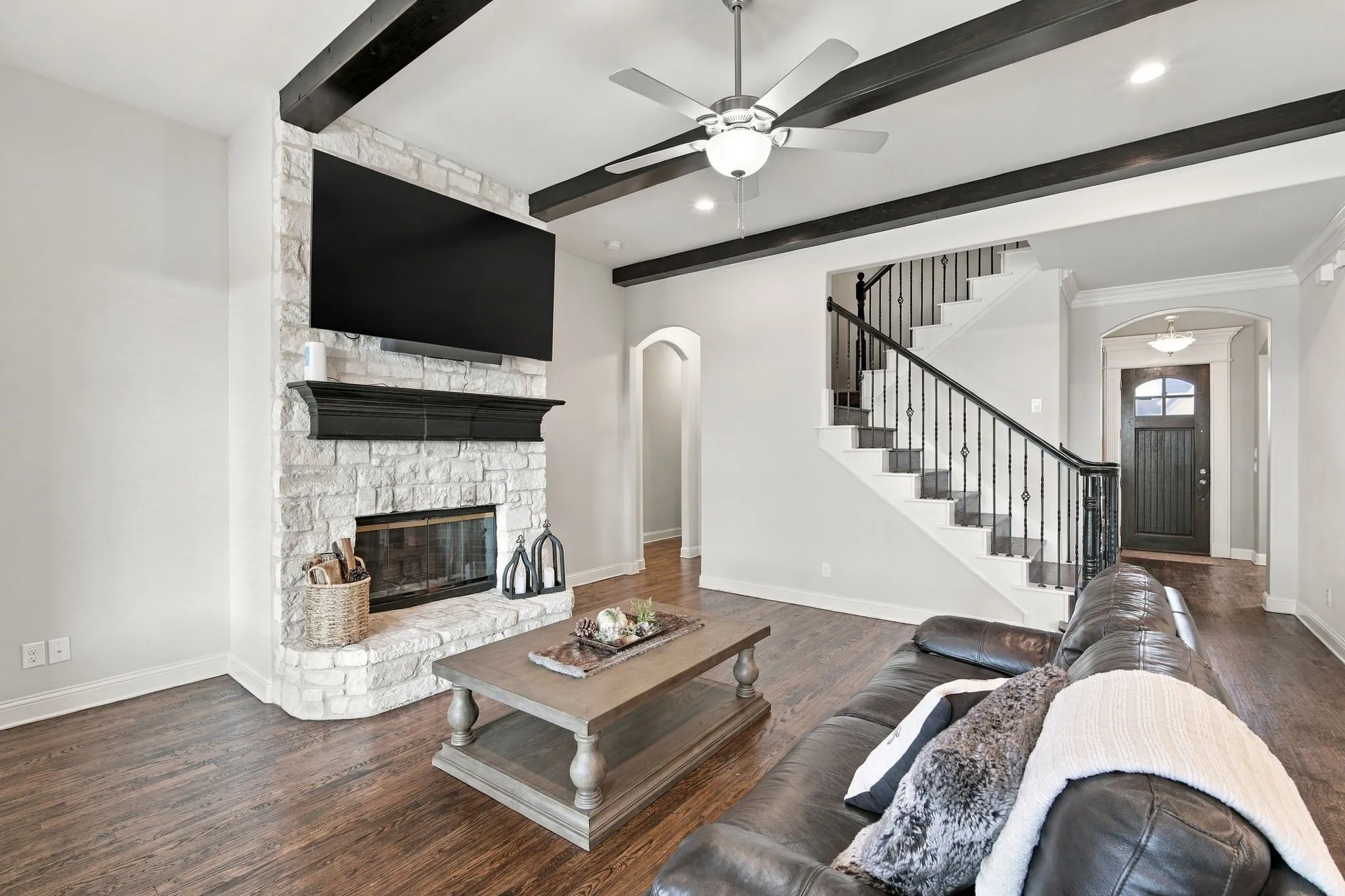Stone, wood burning fireplace and all wood staircase to the media room