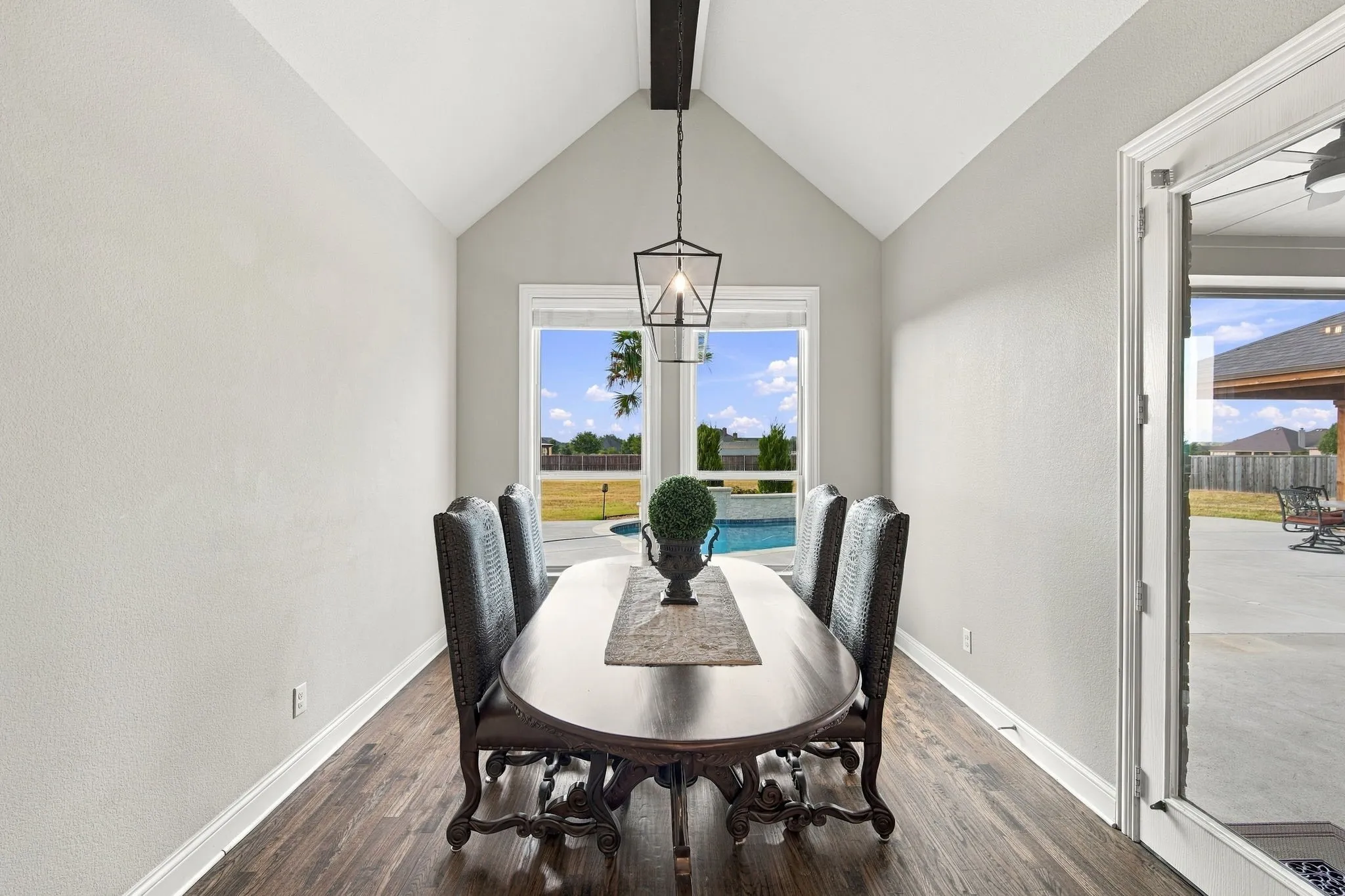 Spacious dining area overlooks the pool and spacious back yard.