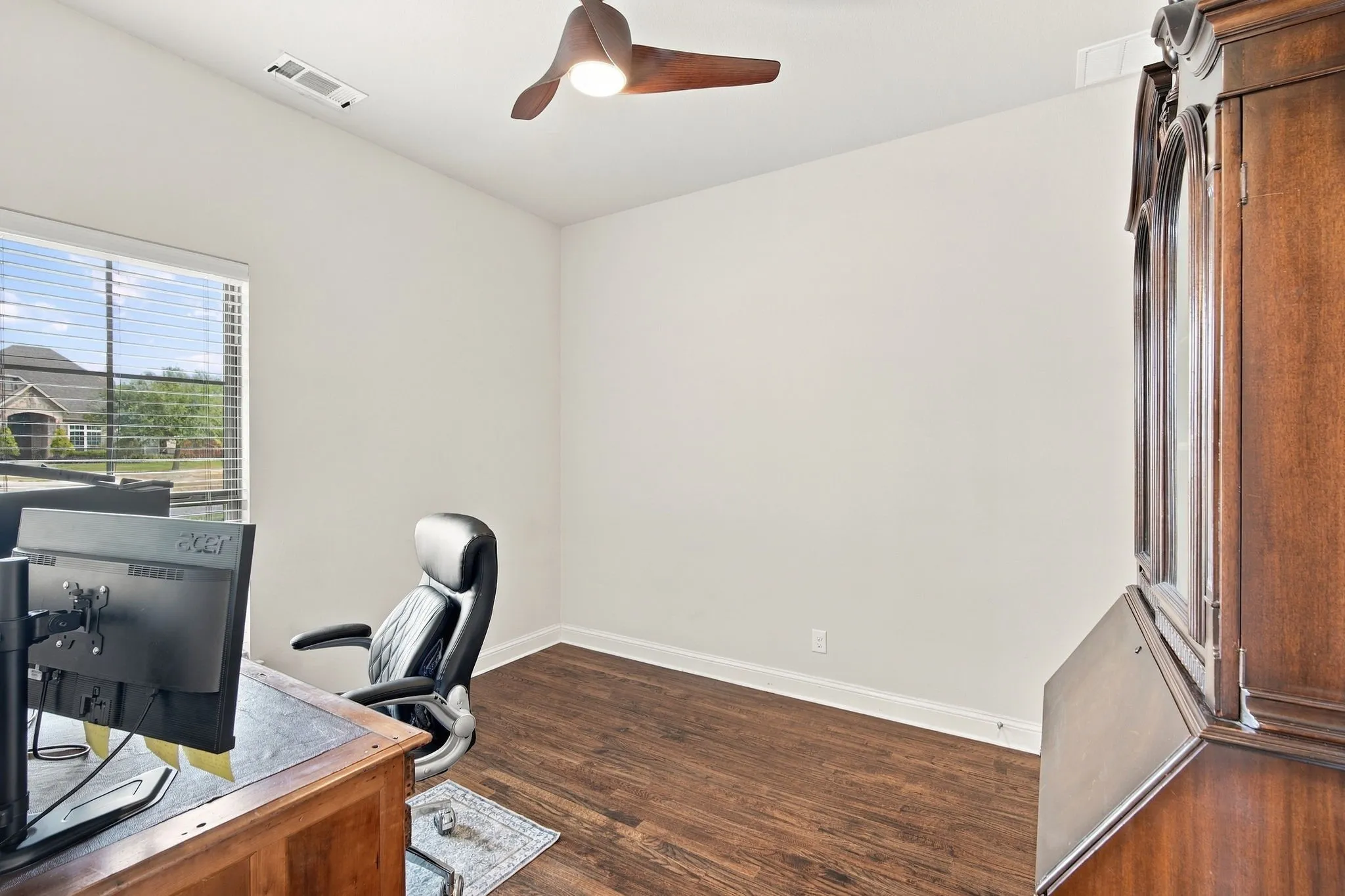 Guest Bedroom with hardwood flooring