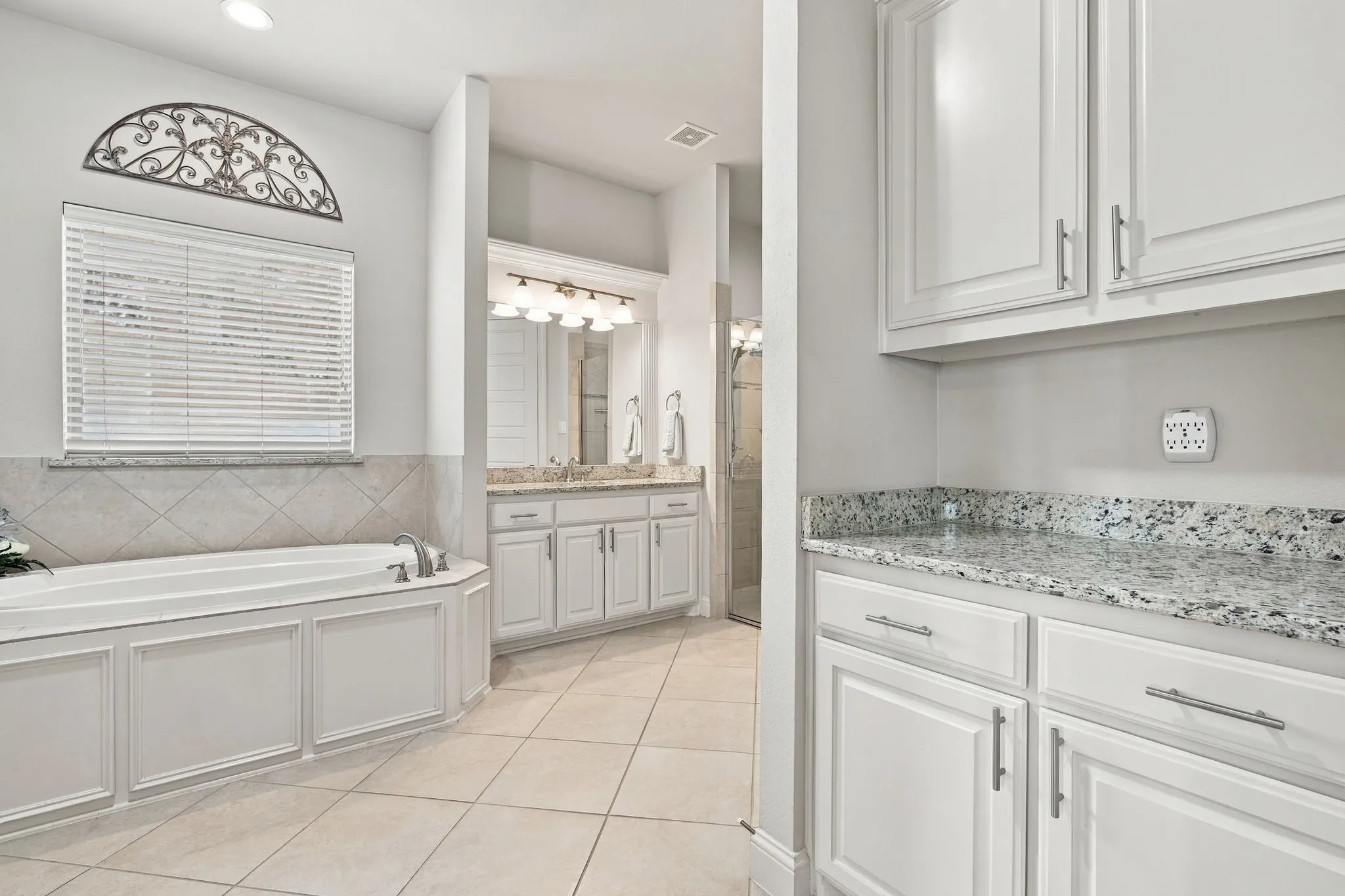Primary Bath has extra storage space to meet all of your needs.