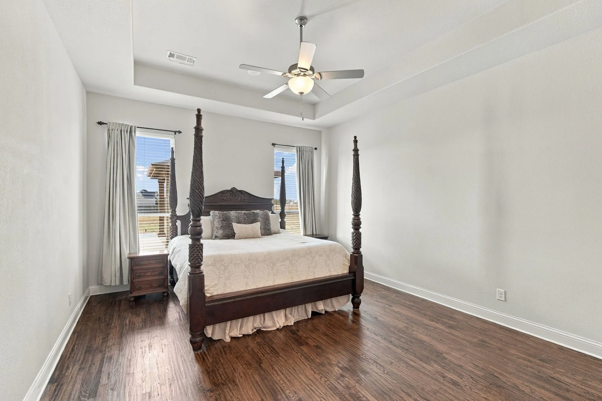 Tray ceilings, hardwood flooring, and ample room   in this luxurious suite