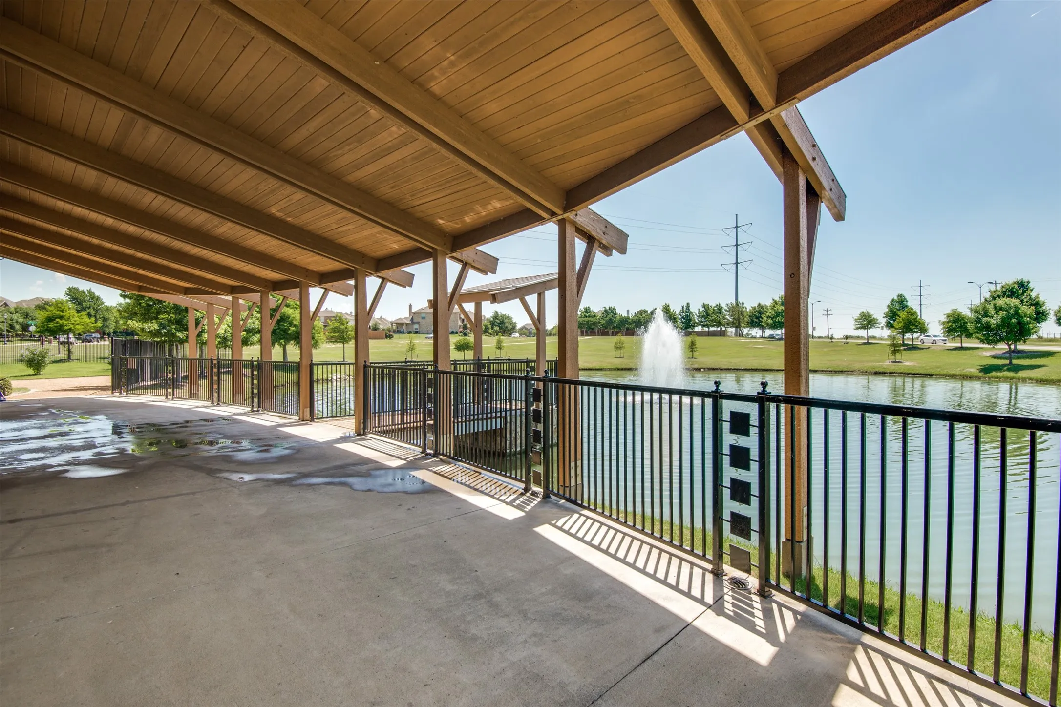 Relax and enjoy peaceful pond views from the community’s covered pavilion—an inviting spot to gather, unwind, and enjoy the outdoors.
