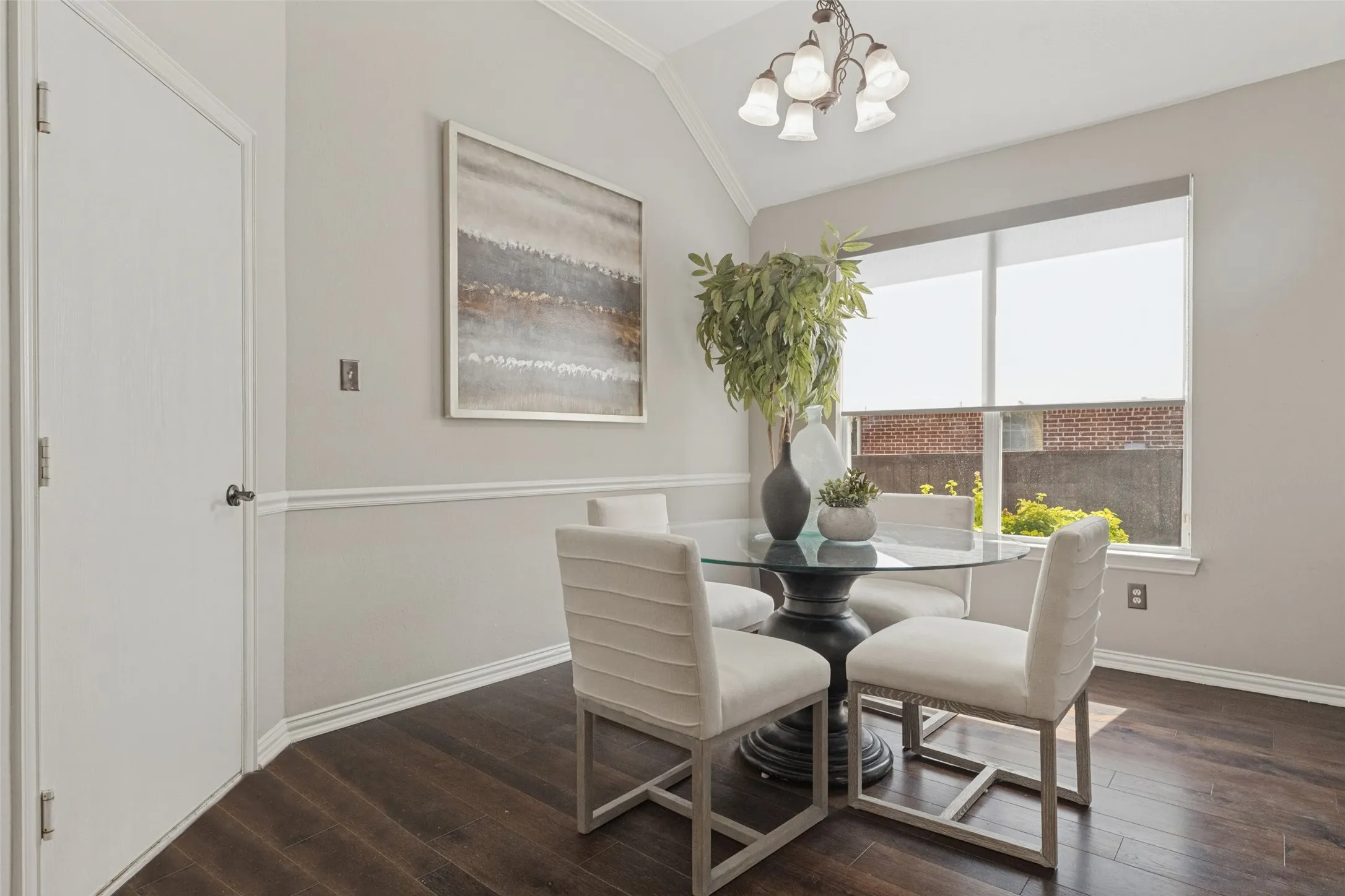 Bright breakfast nook just off the kitchen offers a cozy spot for casual dining, with natural light and easy access to the outdoor living space.