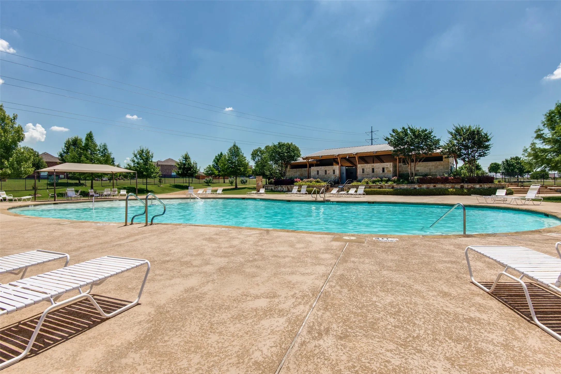 Enjoy sunny days at the Panther Creek community pool—perfect for relaxing, cooling off, and enjoying the neighborhood amenities.