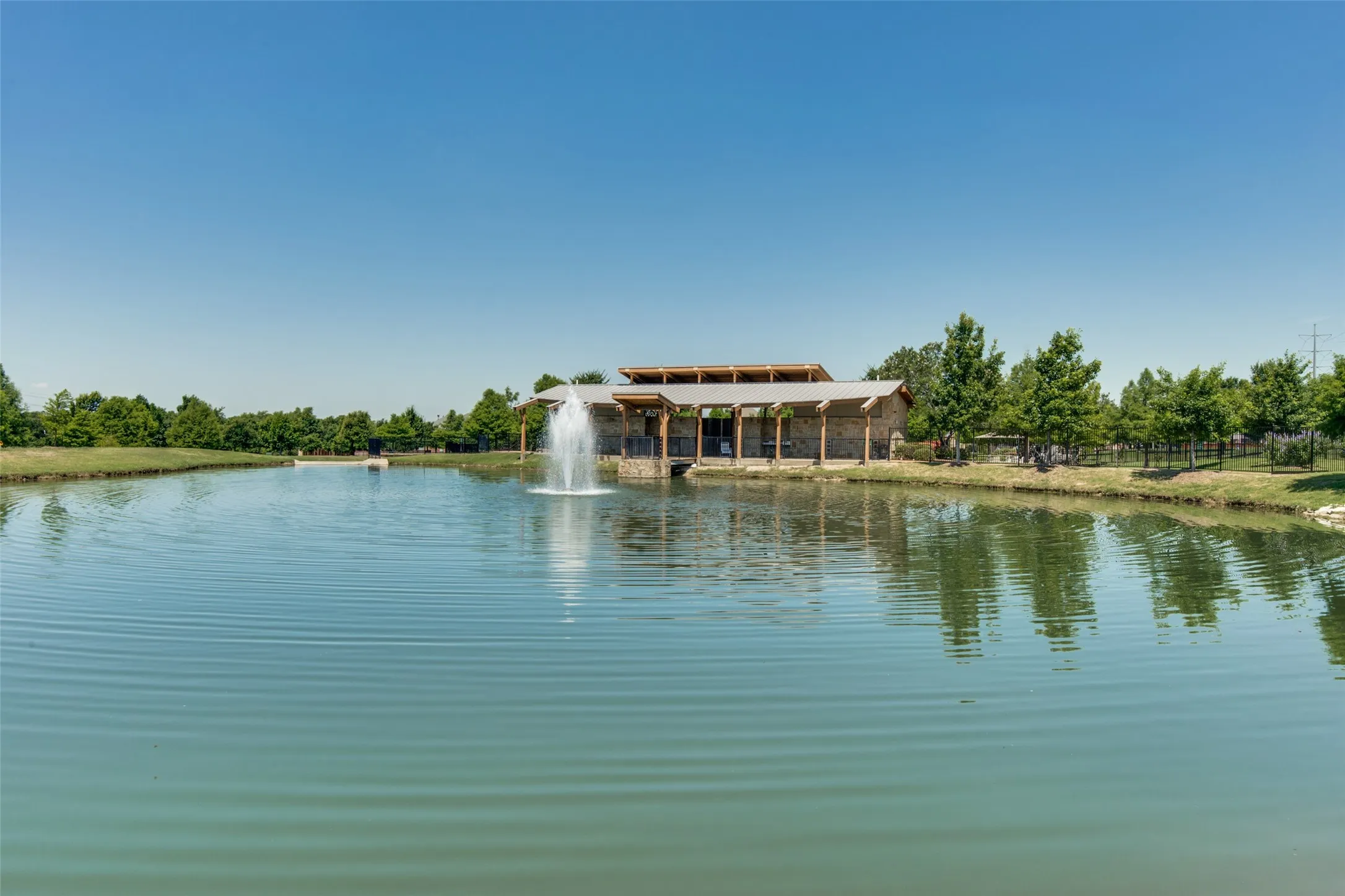 Enjoy the scenic community pond and peaceful outdoor spaces that add to the charm of Dominion at Panther Creek.