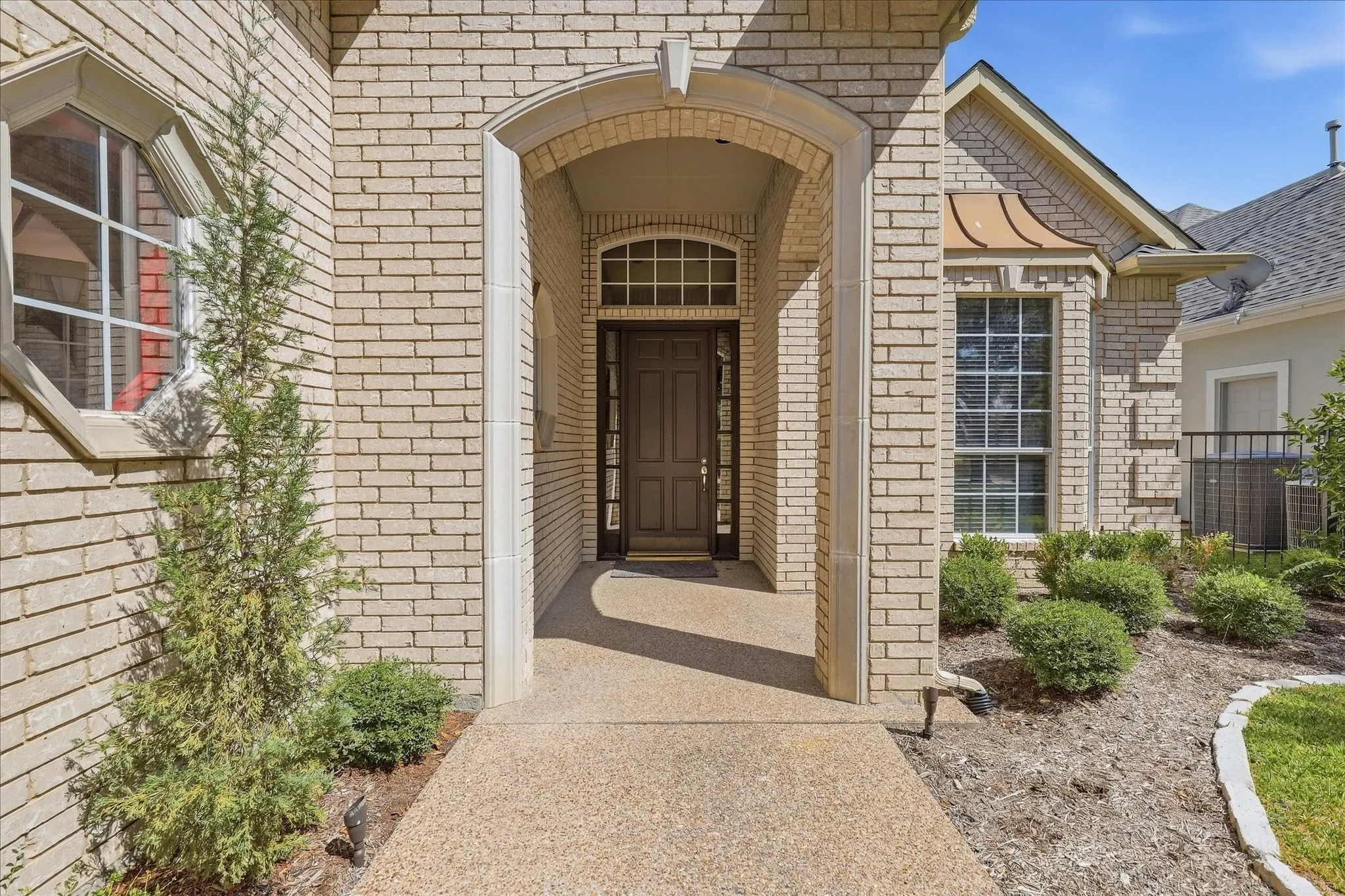 The covered front porch protects packages and guests from inclement weather.