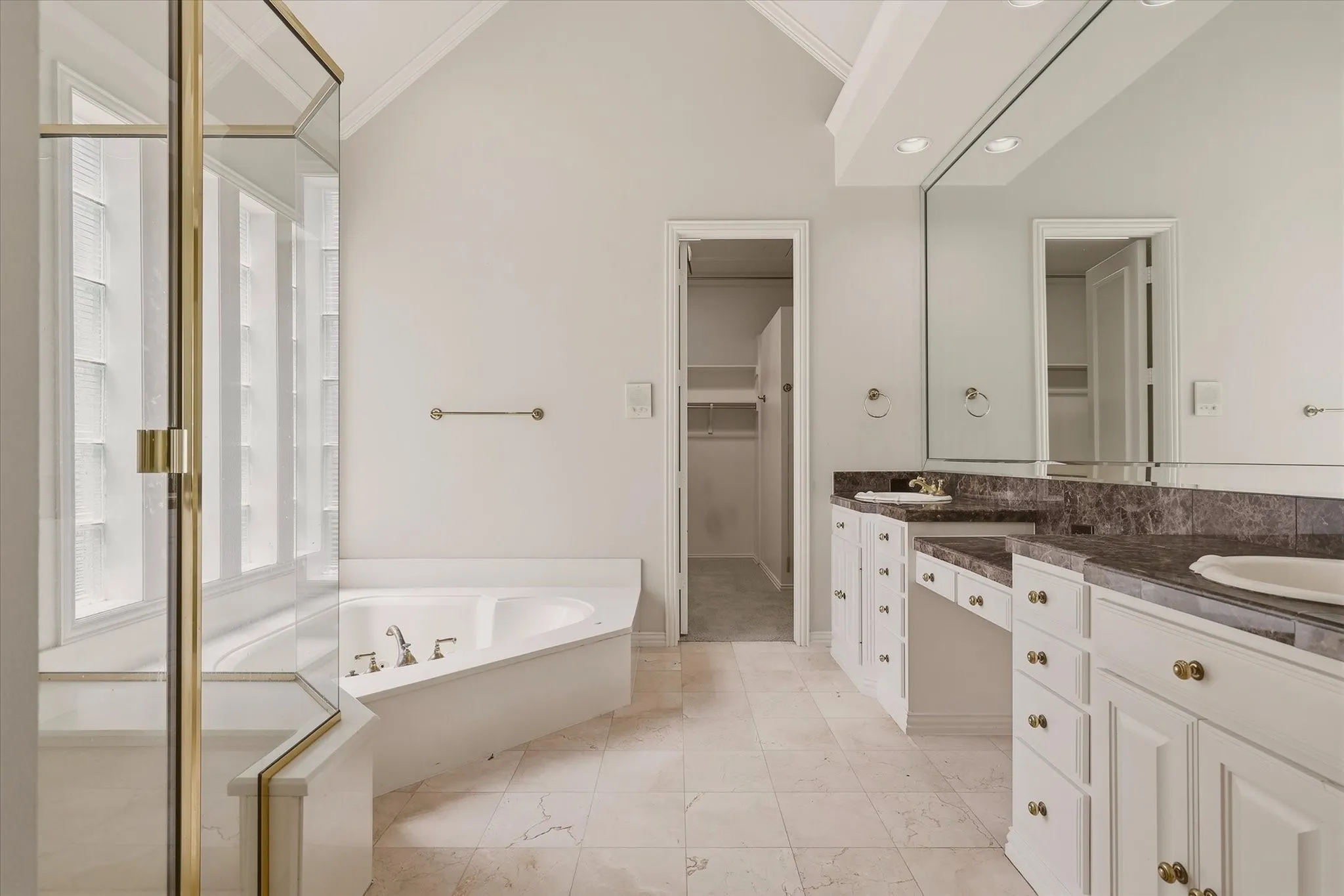 The Primary bath offers marble counter-tops and floors.