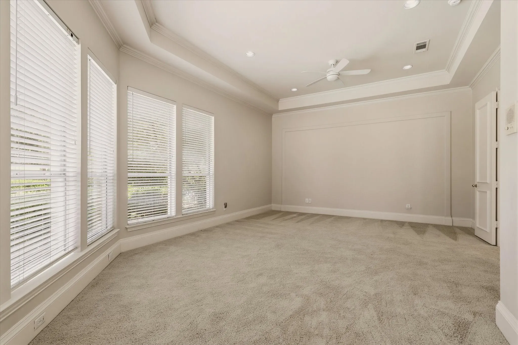 The Primary Bedroom also offers a sitting area and backyard pool and golf views.