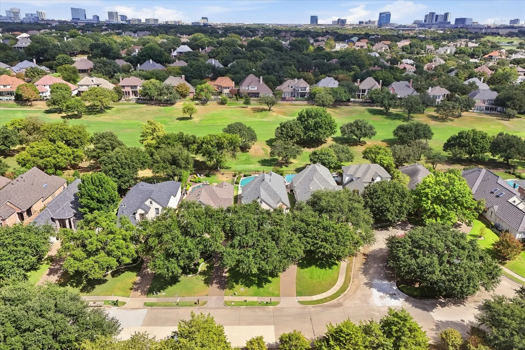 Aerial view showing the golf course behind the home.