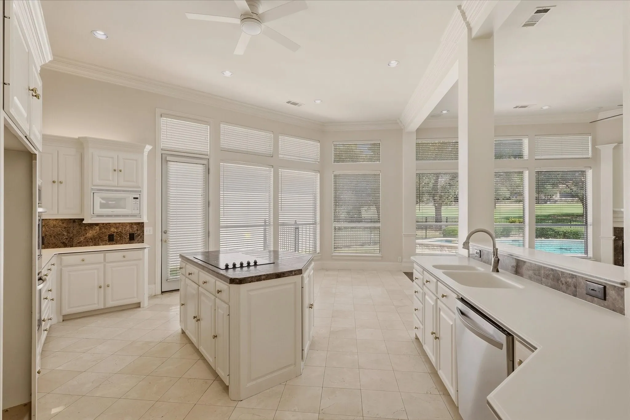 Kitchen view showing the Breakfast area and pool and golf course views.
