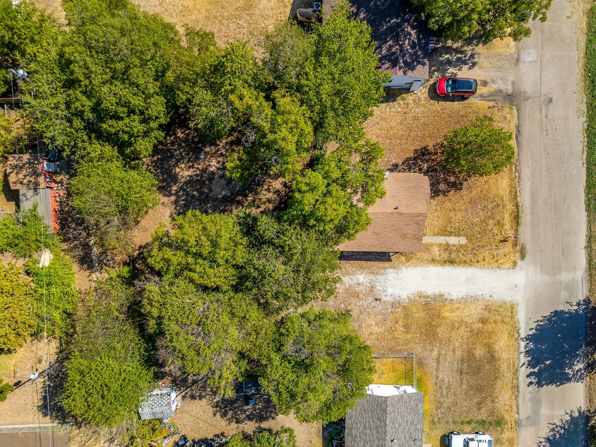 View over the top of the tree line and newer roof 2017.