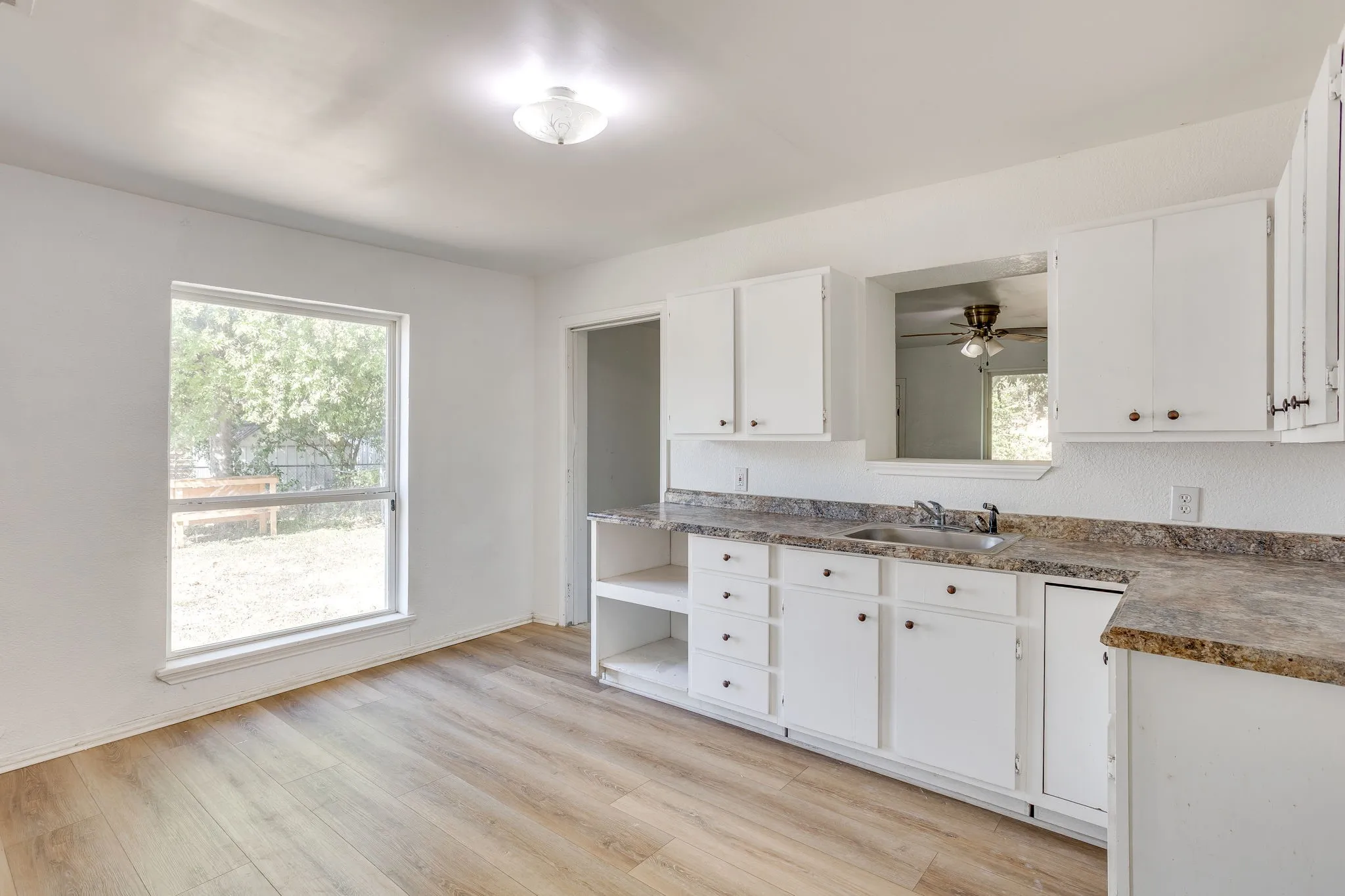 Kitchen with great natural light and a small space for eat in.