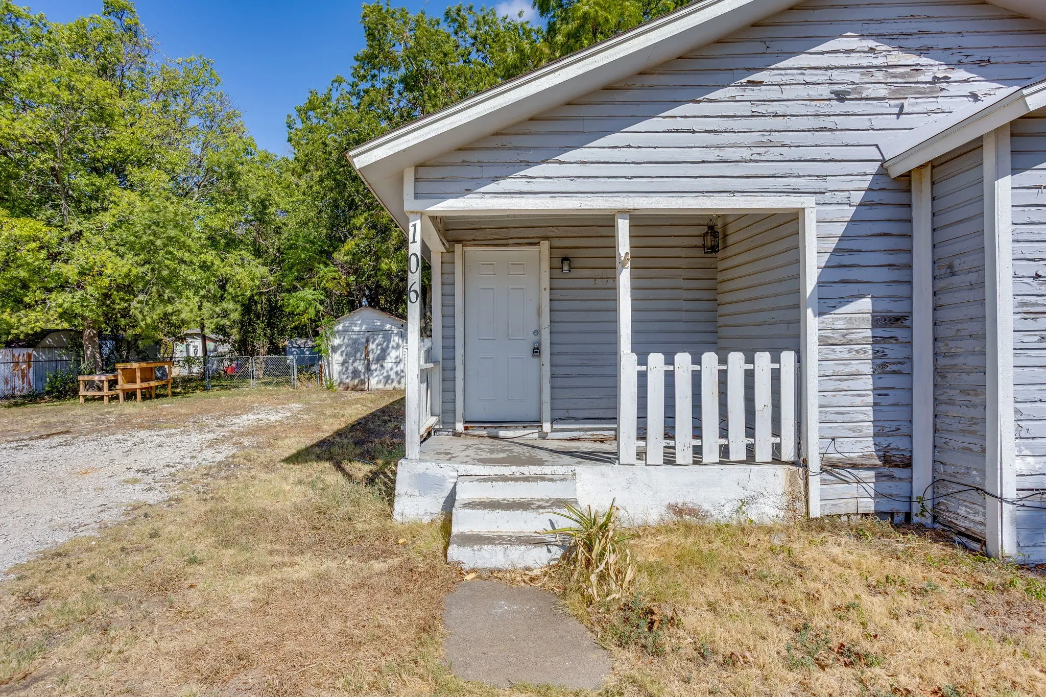 Welcome home to this sweet property with covered porch. A little TLC could make this property shine!