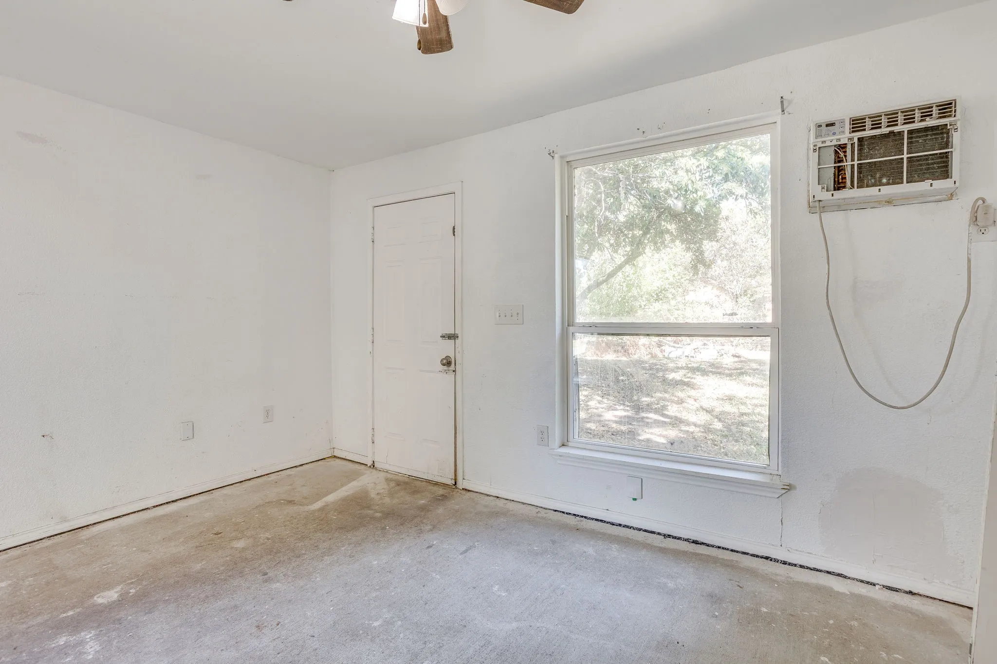 Enclosed porch serves as the utility room now open to the kitchen.
