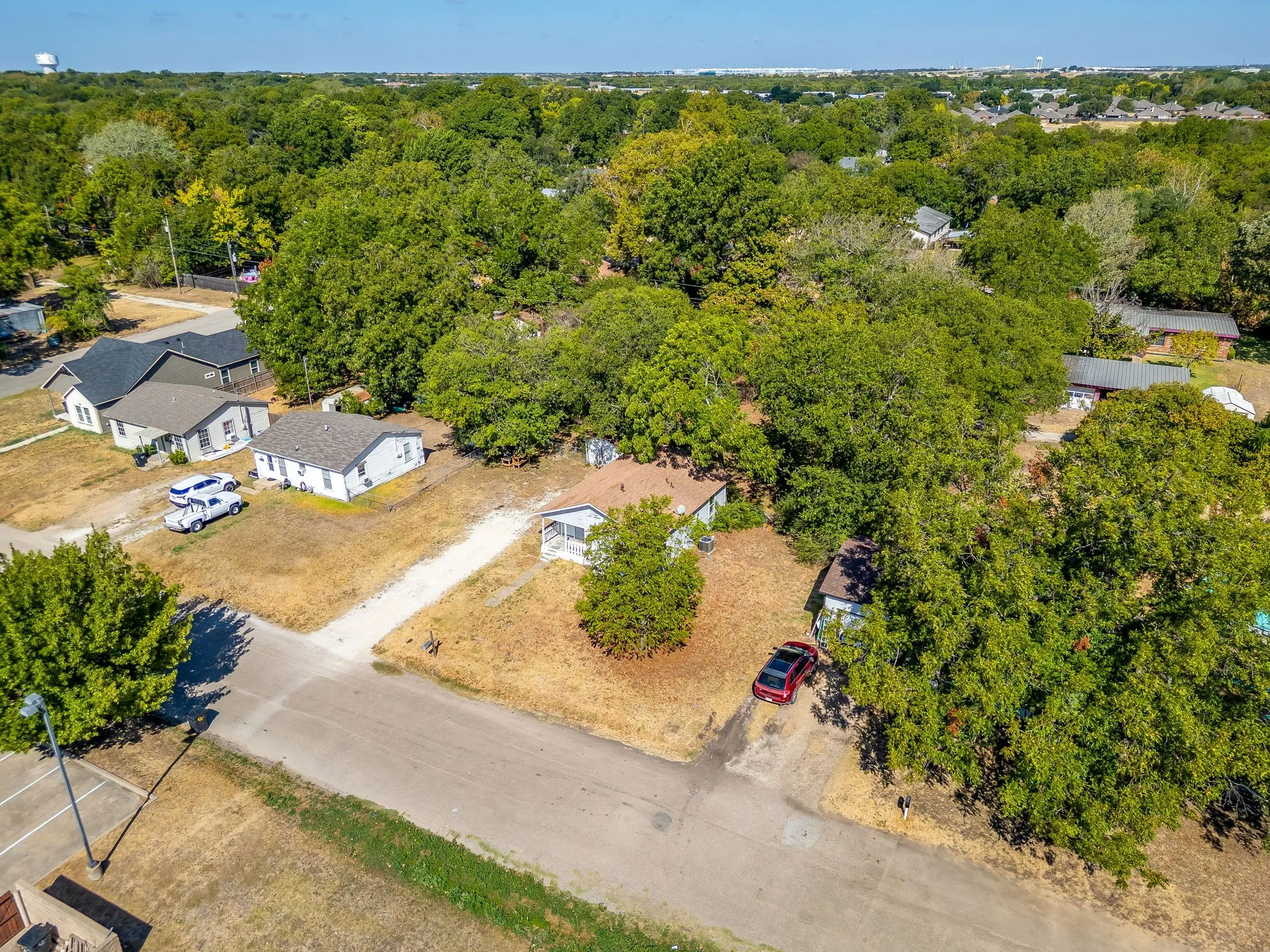 Aerial street view of the property with plenty of space between neighbors.