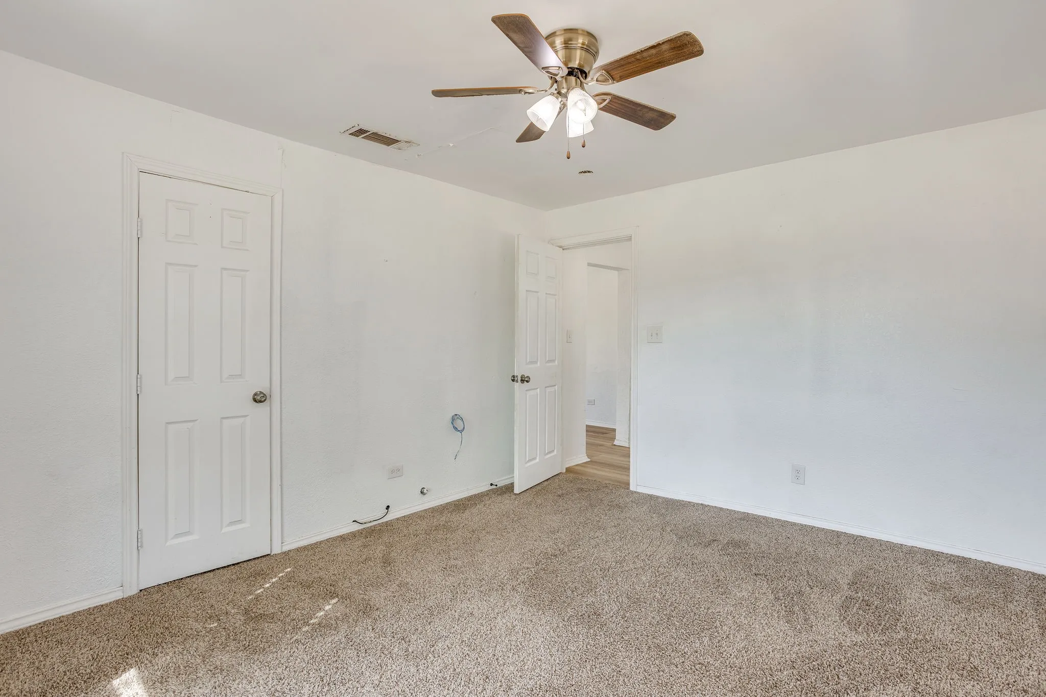 Secondary bedroom with hallway bath close for convenience.