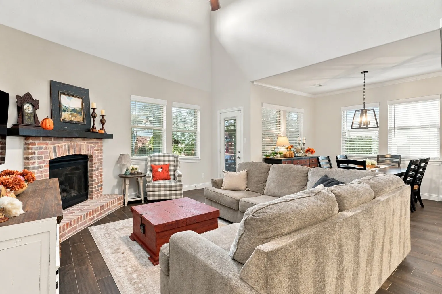 Tall celings, natural light and an upgraded brick fire place