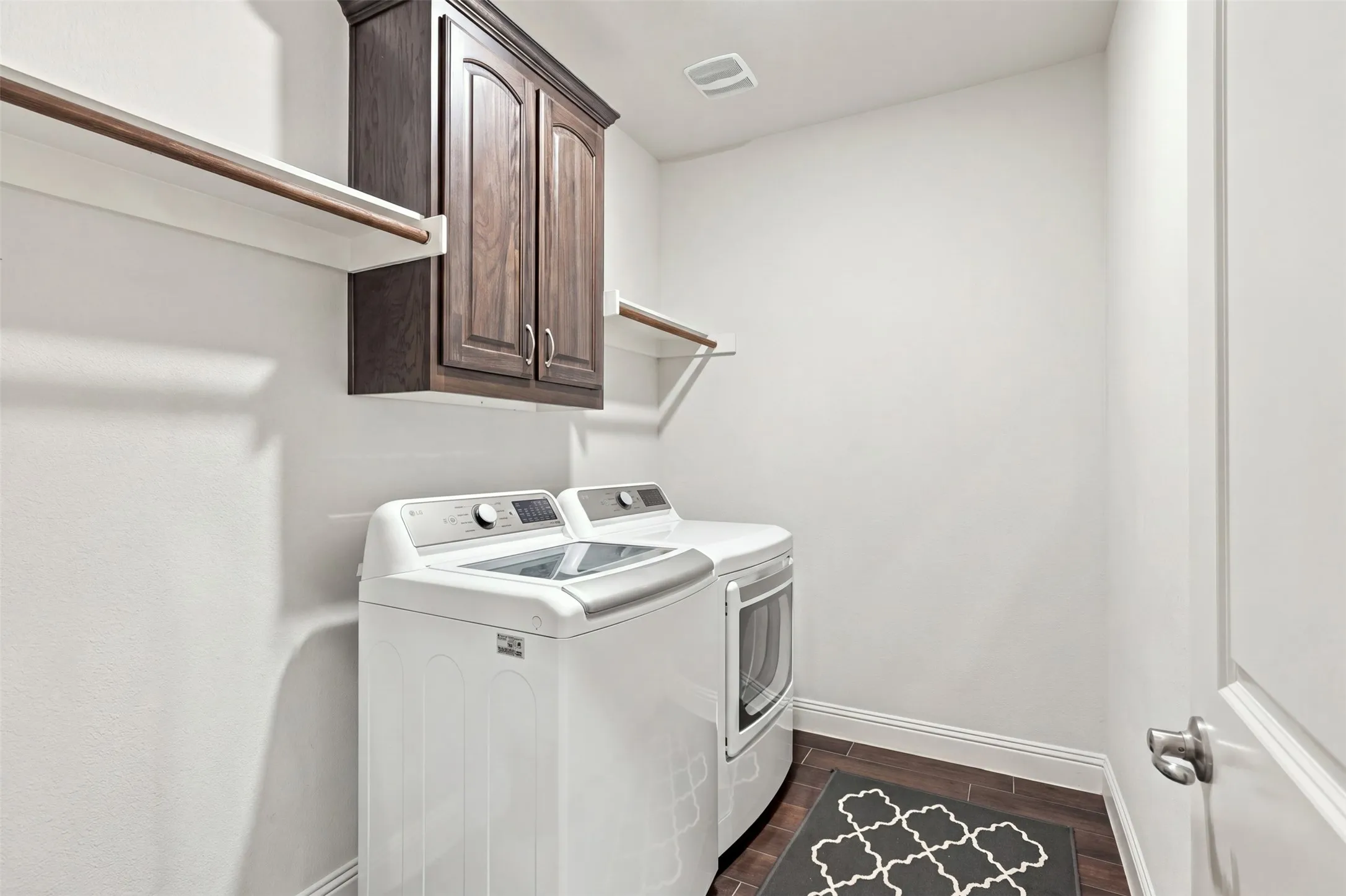 Laundry room on the first floor with extra space for another refrigerator!