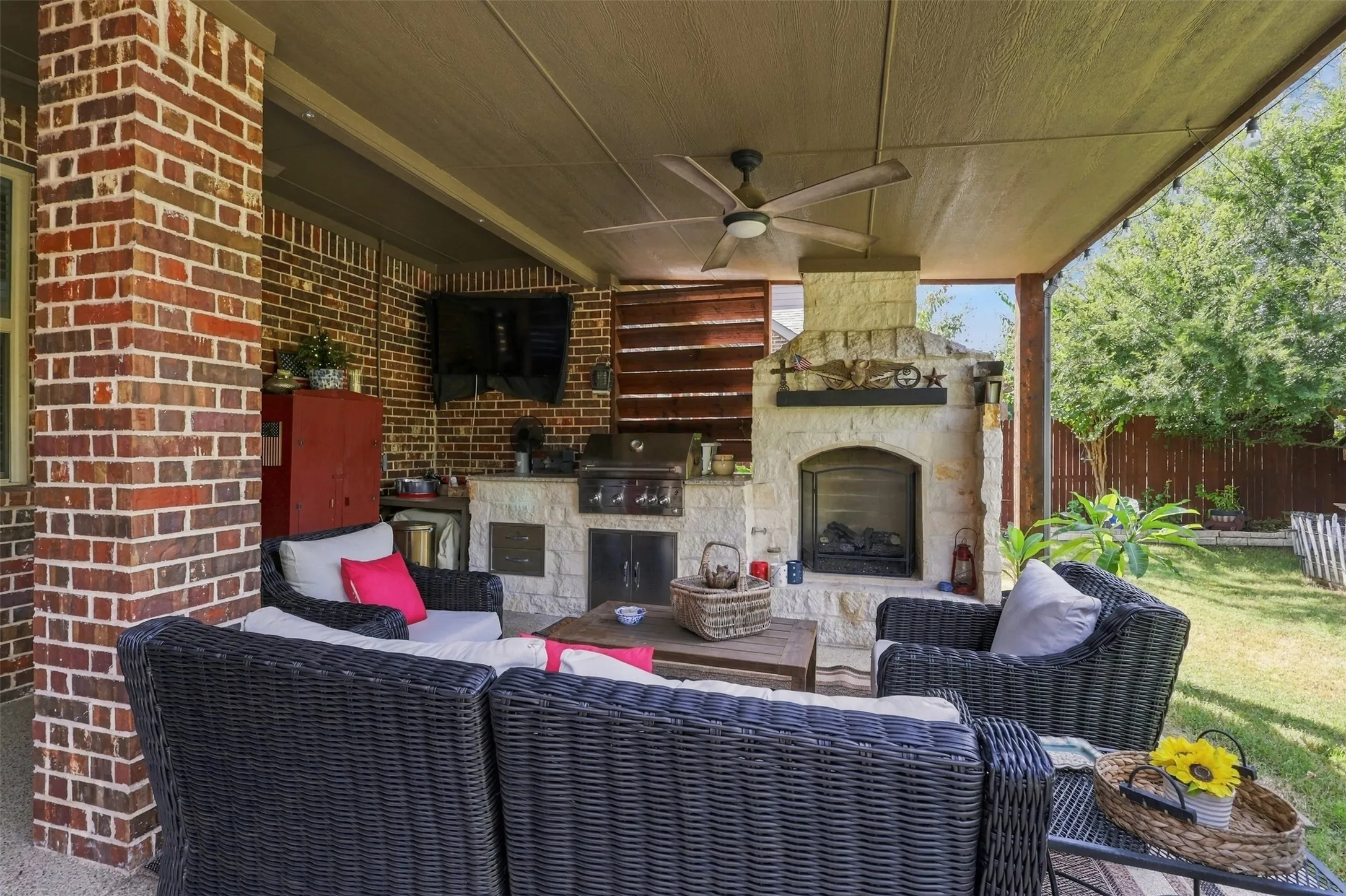 This patio is a dream! Extended pergola, built in fire place and grill great for entertaining.
