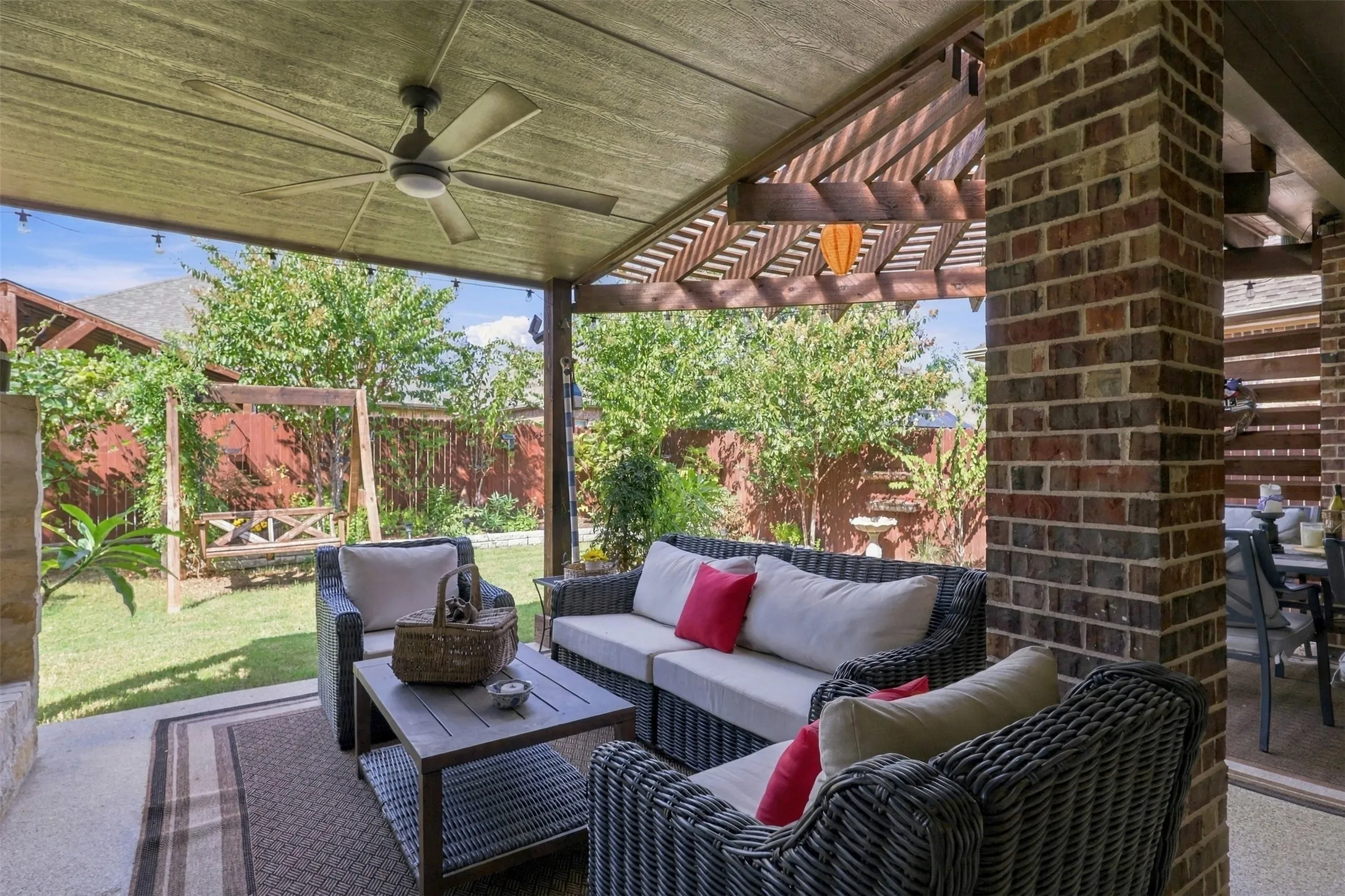 This patio is a dream! Extended pergola, built in fire place and grill great for entertaining.