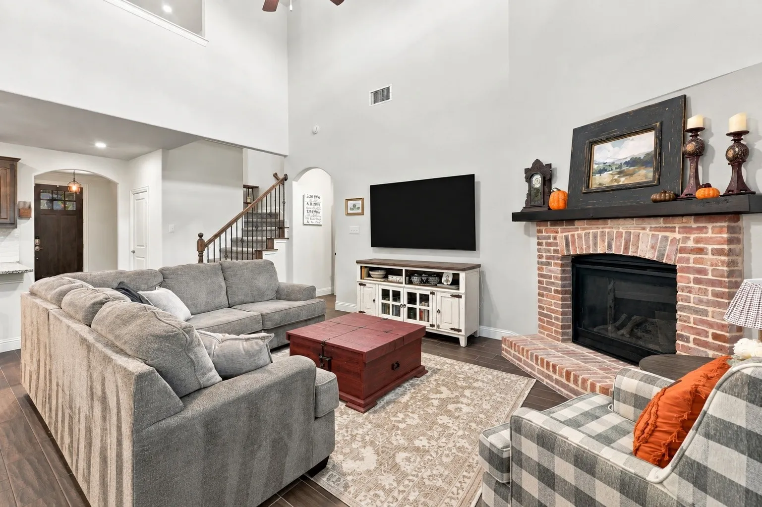 Tall celings, natural light and an upgraded brick fire place