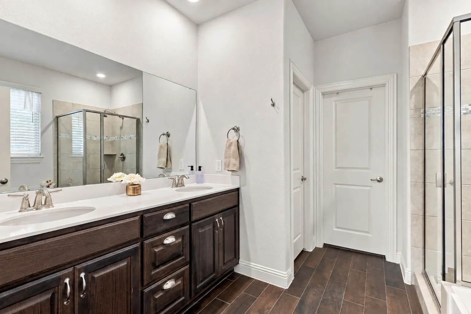 Primary bathroom with separate shower and walk in closet