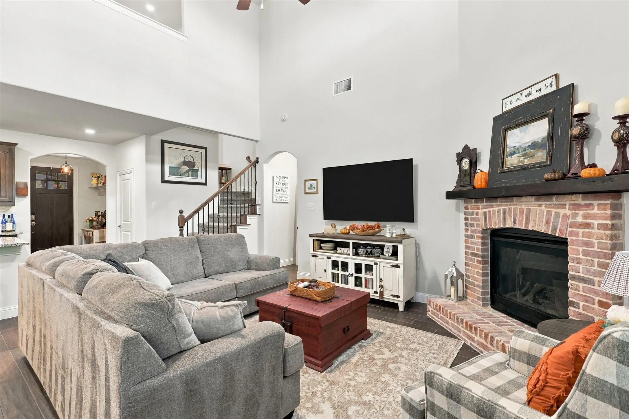 Tall celings, natural light and an upgraded brick fire place