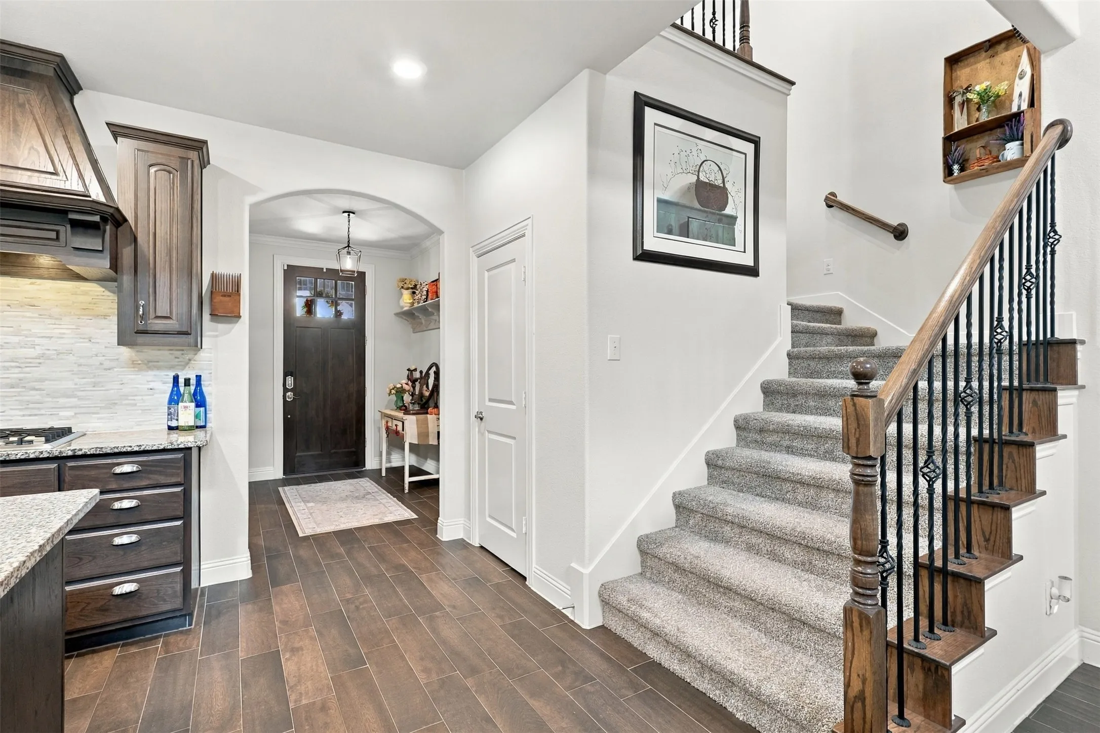 View of the front entry. The front of the home features a bedroom/ full bath and laundry room