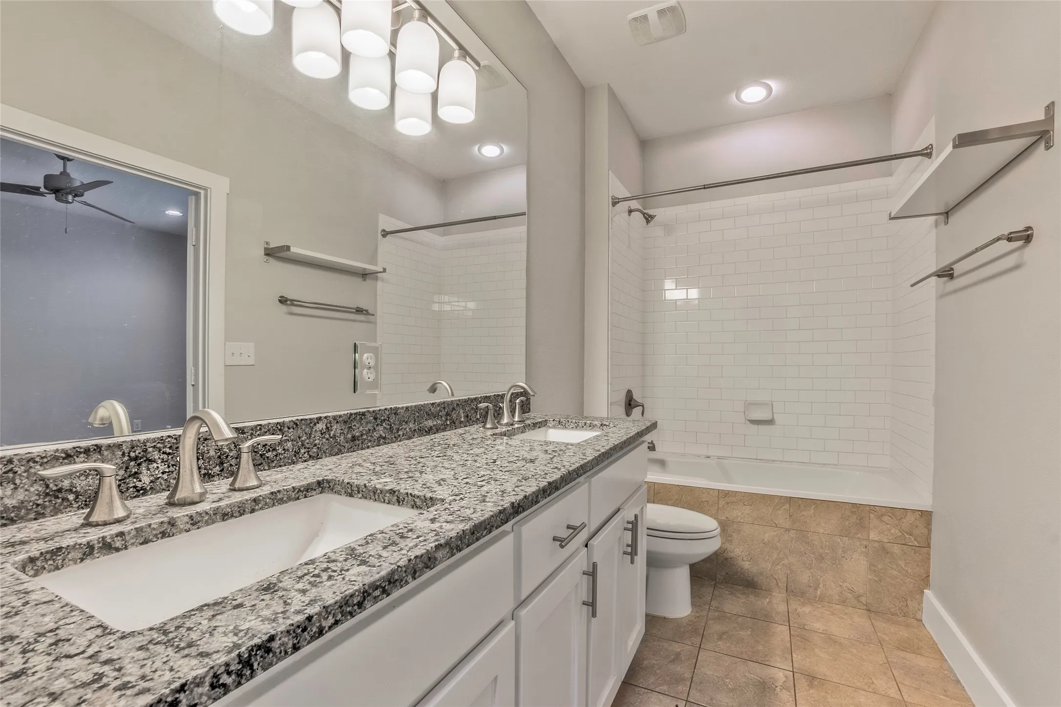 Double vanity with granite countertop and undermount sinks