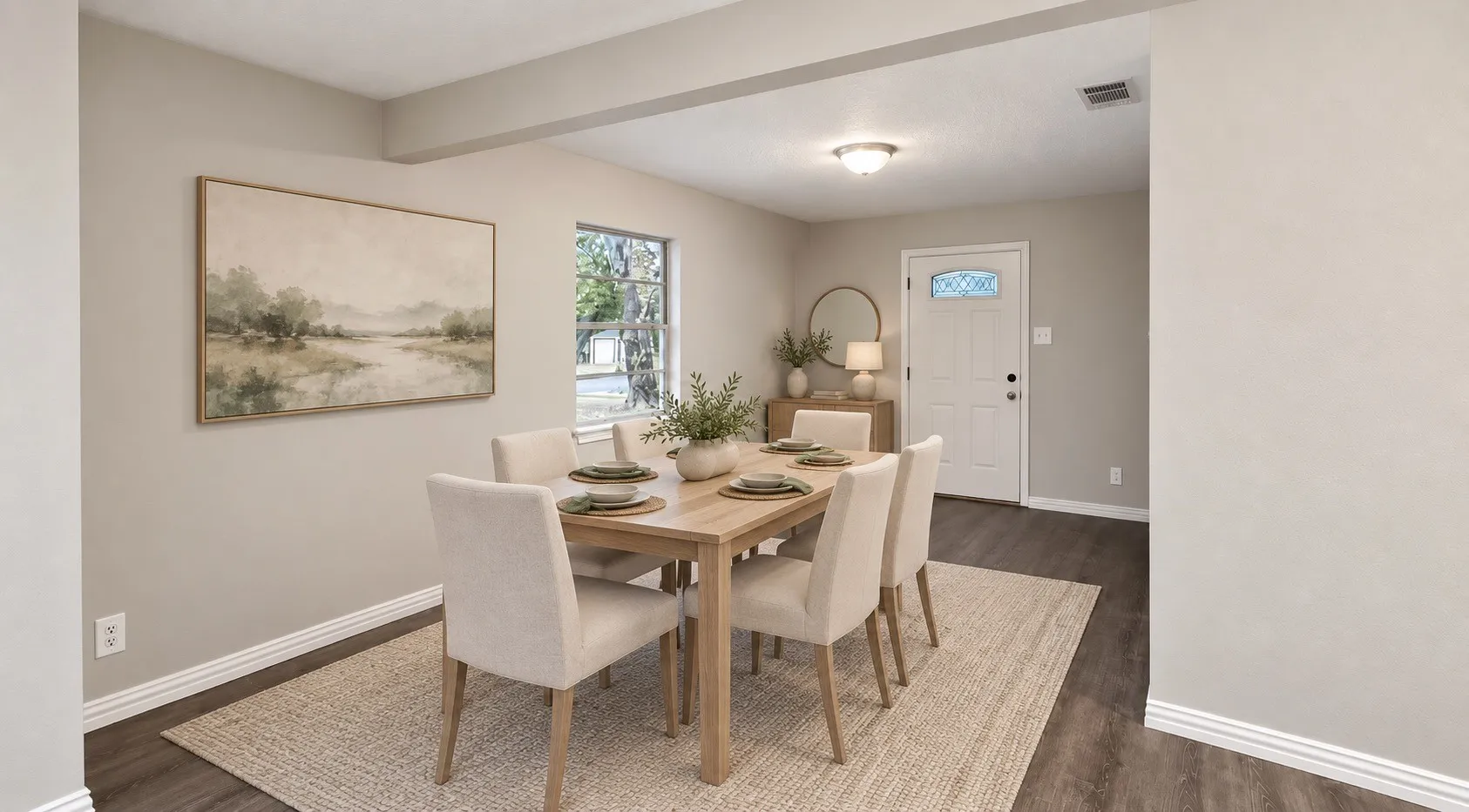 Wood-finish flooring, recessed lighting, and a window providing natural light. Virtually staged.