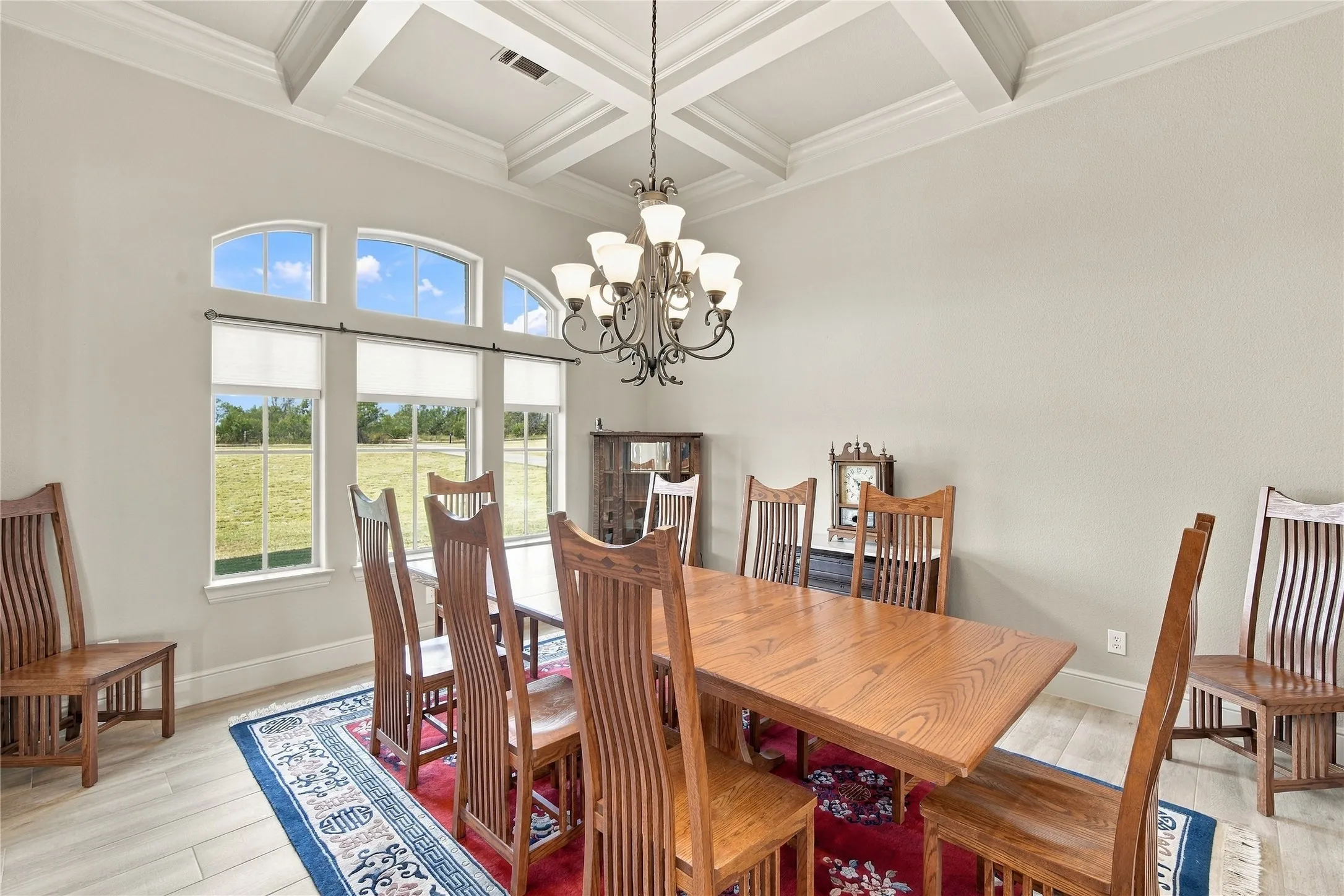 Host memorable dinners beneath the coffered ceiling and chandelier, with arched transom windows filling the room with light.