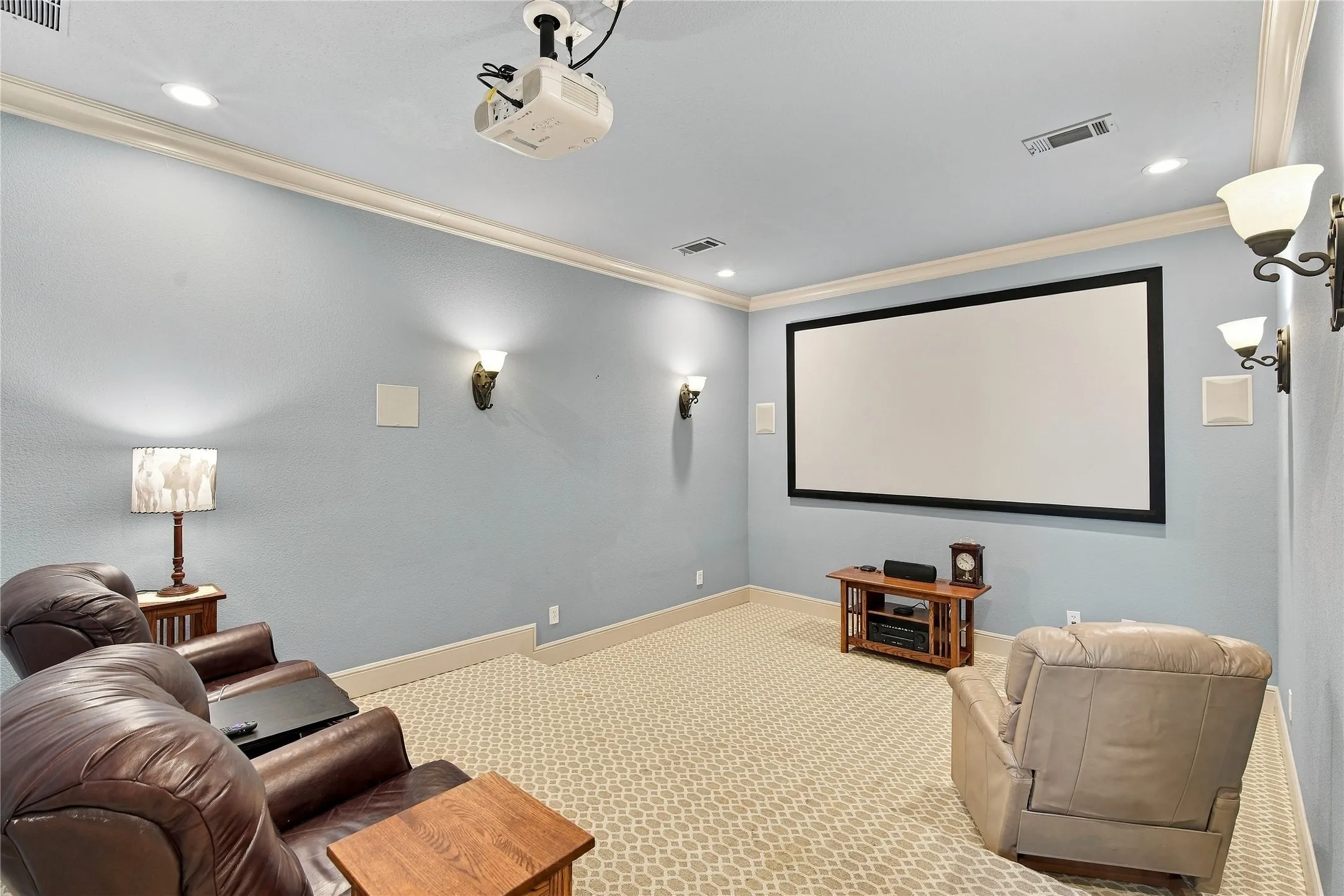 Movie nights just got easier with a built-in projection screen and dedicated media room lighting.