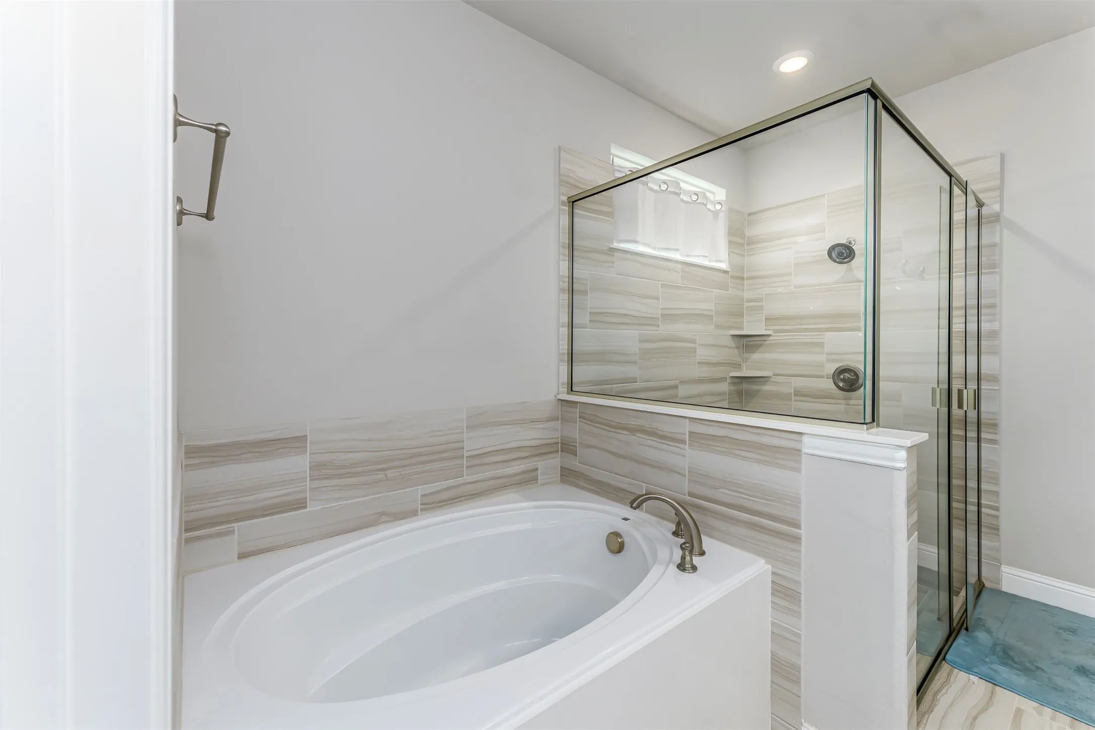 Soaking tub with brushed nickel fixtures