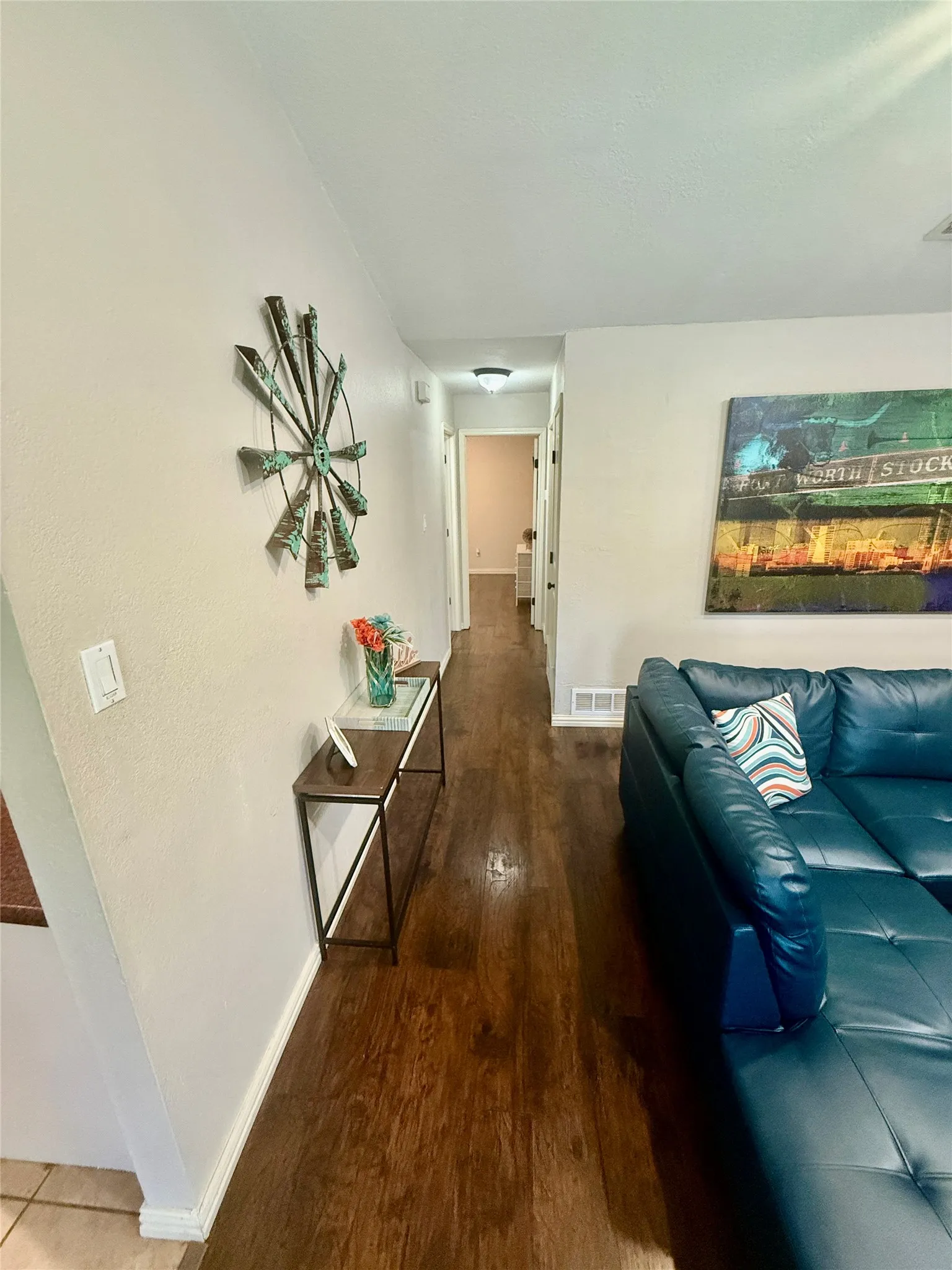 Wood-finish flooring throughout the main corridor