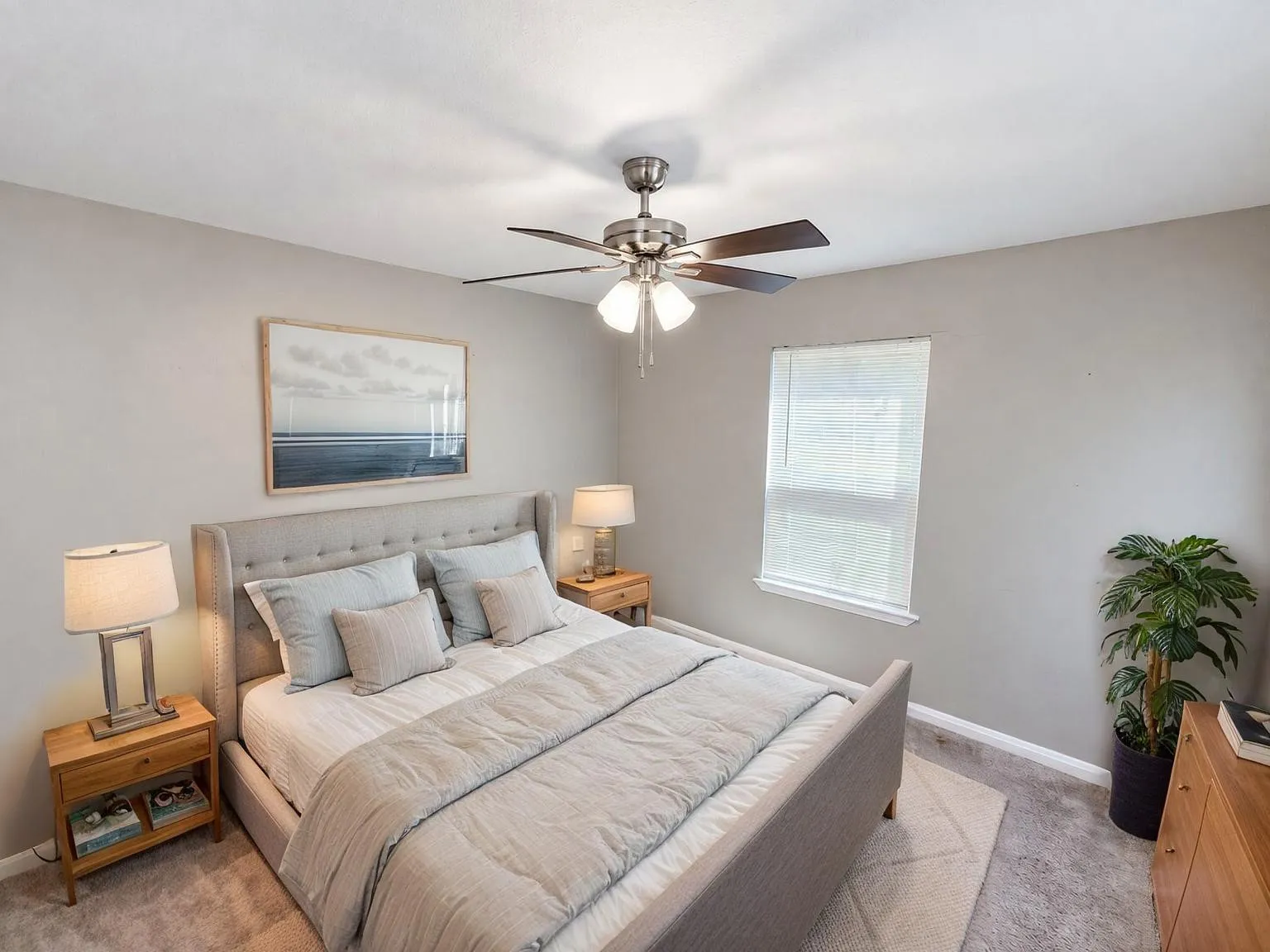 Virtually staged -
Wall-to-wall carpeting with light gray walls, a window with blinds, and a ceiling fan with integrated lighting