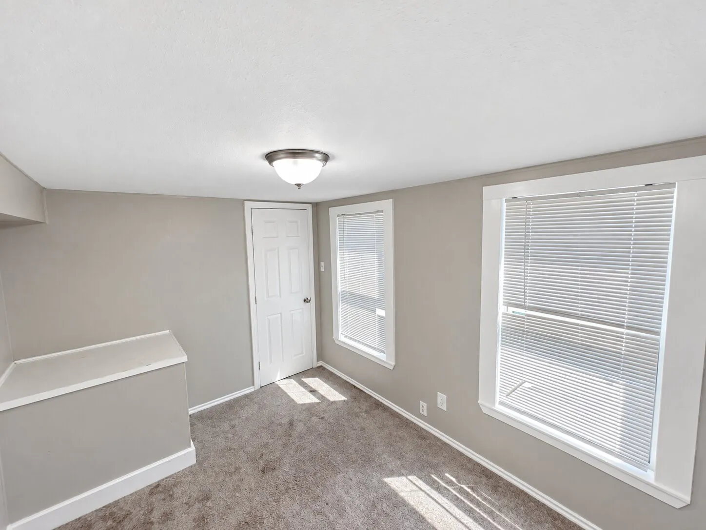 Neutral wall tones with crisp white trim