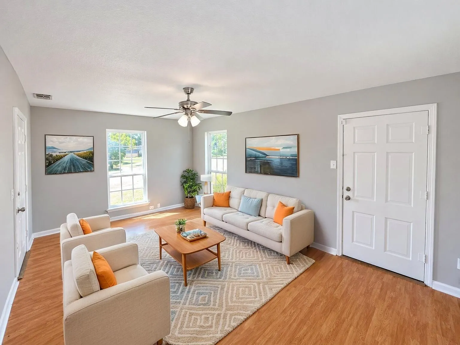 Virtually staged -
Wood-finish flooring, light gray walls, and white trim