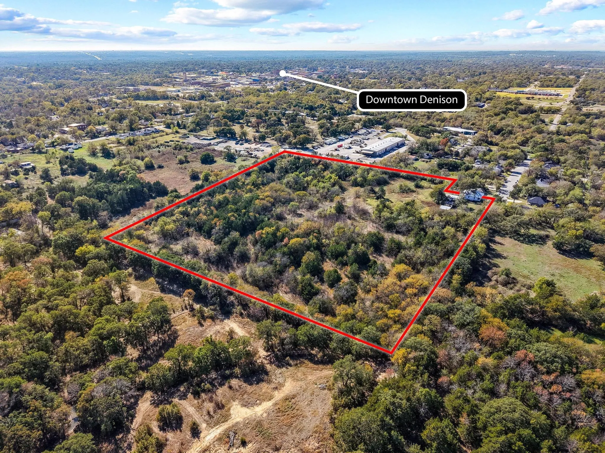Expansive lot featuring mature trees and varied terrain