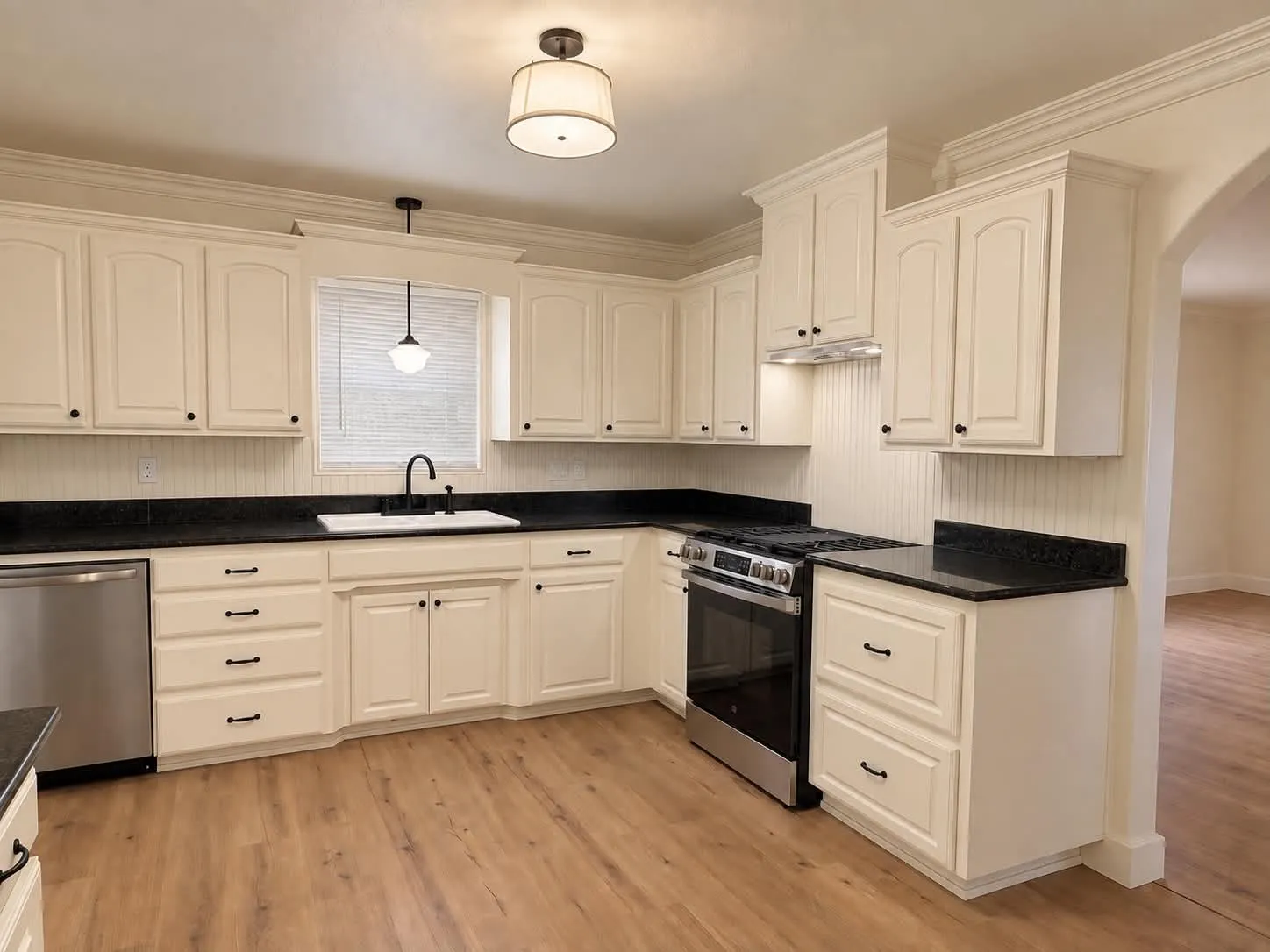 Kitchen with fresh paint, refinished cabinets, and granite countertops.