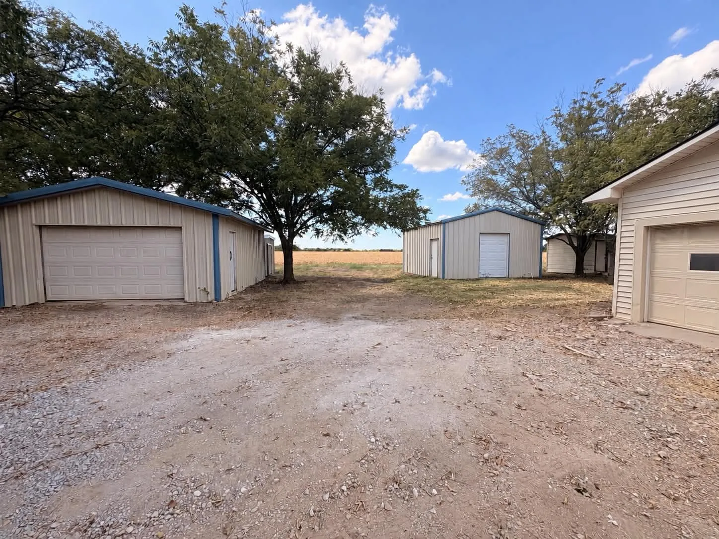 Attached garage with TWO oversized workshops with electricity connected. Plus storage!