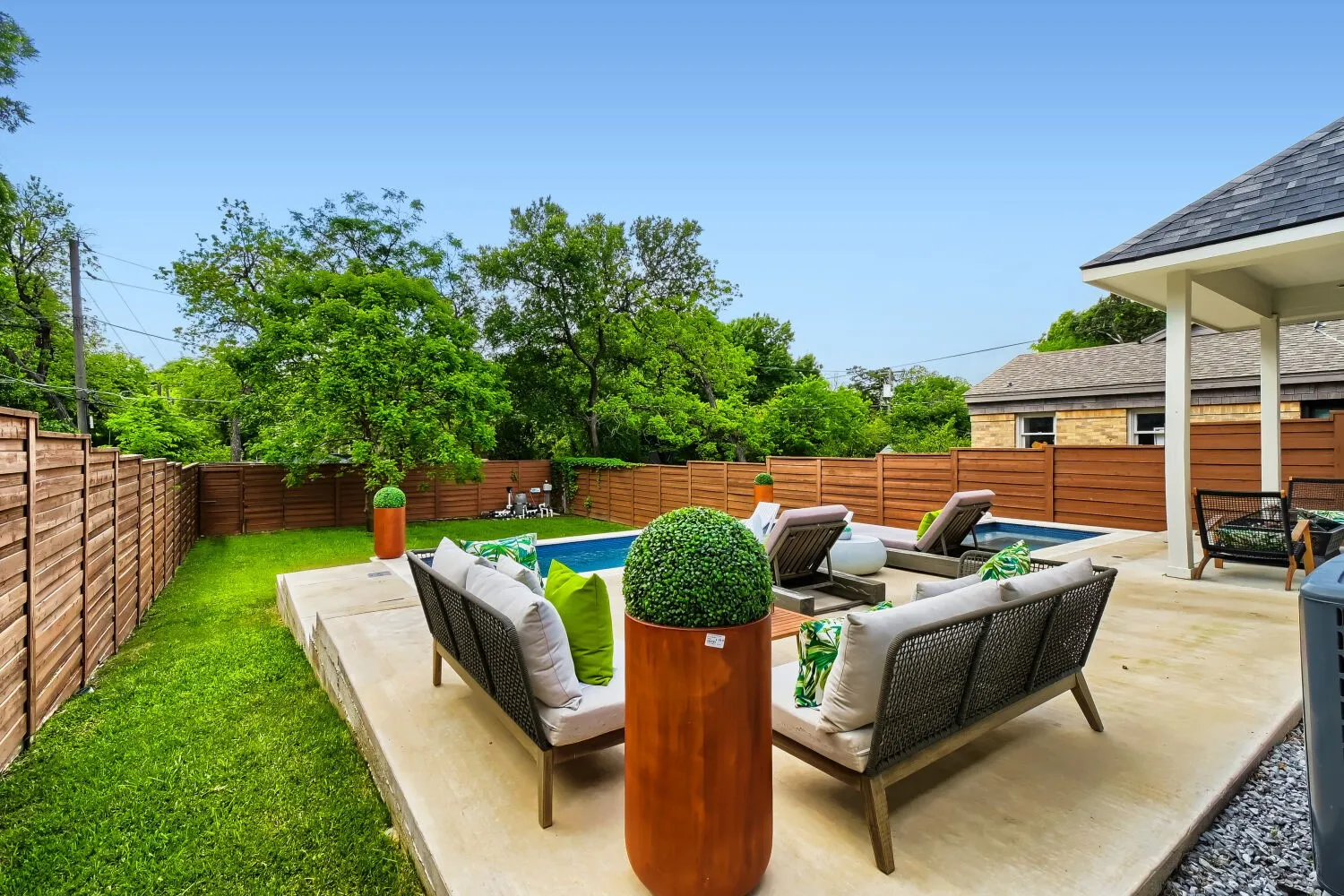 Fenced backyard featuring an outdoor lounge area and a patio area