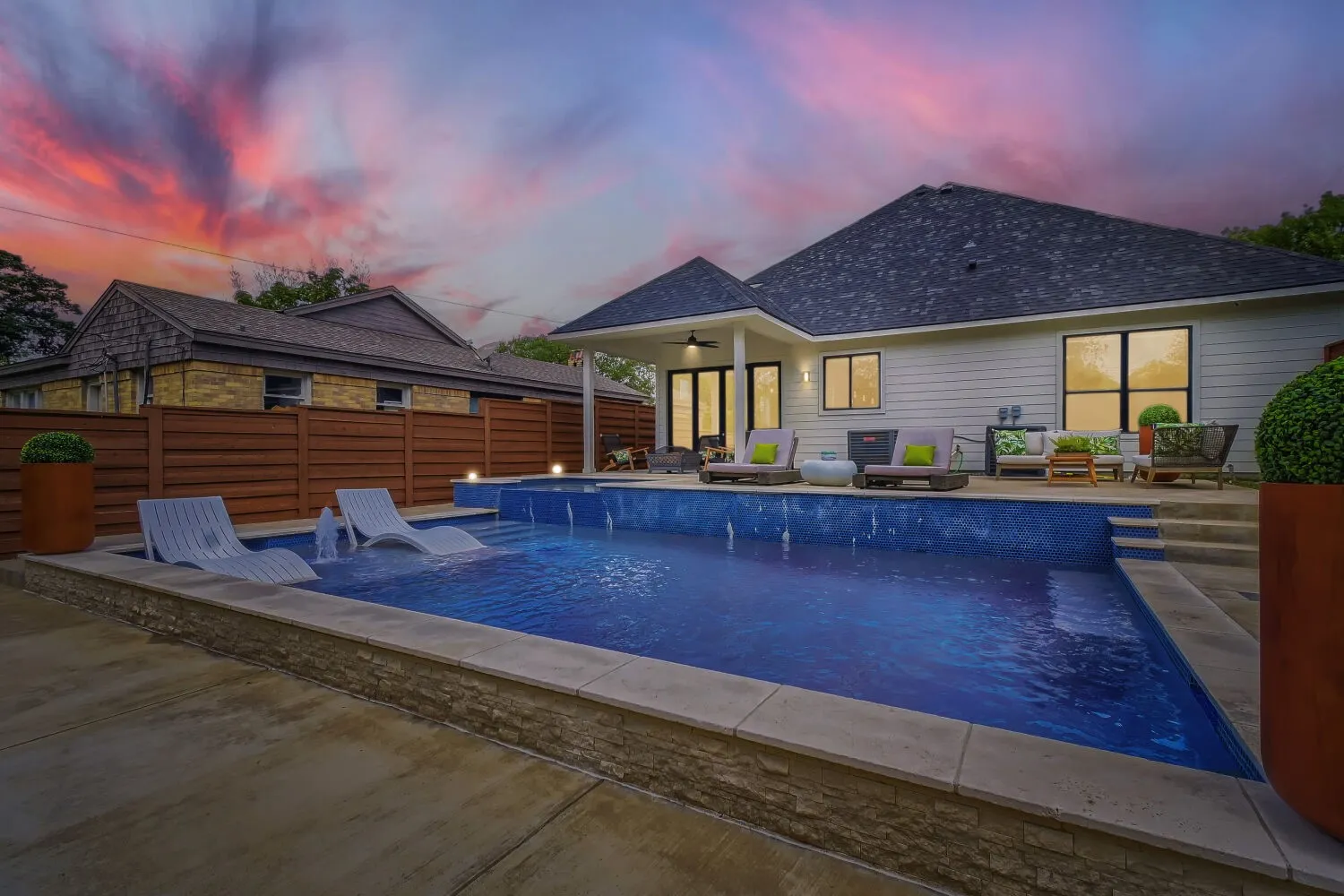 View of pool featuring patio surround and an outdoor lounge area
