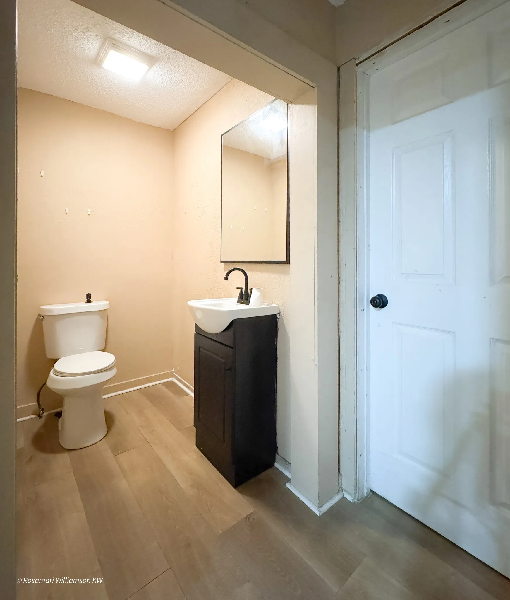 Restroom-2 Located off of Showroom. Door leads to Utility room.