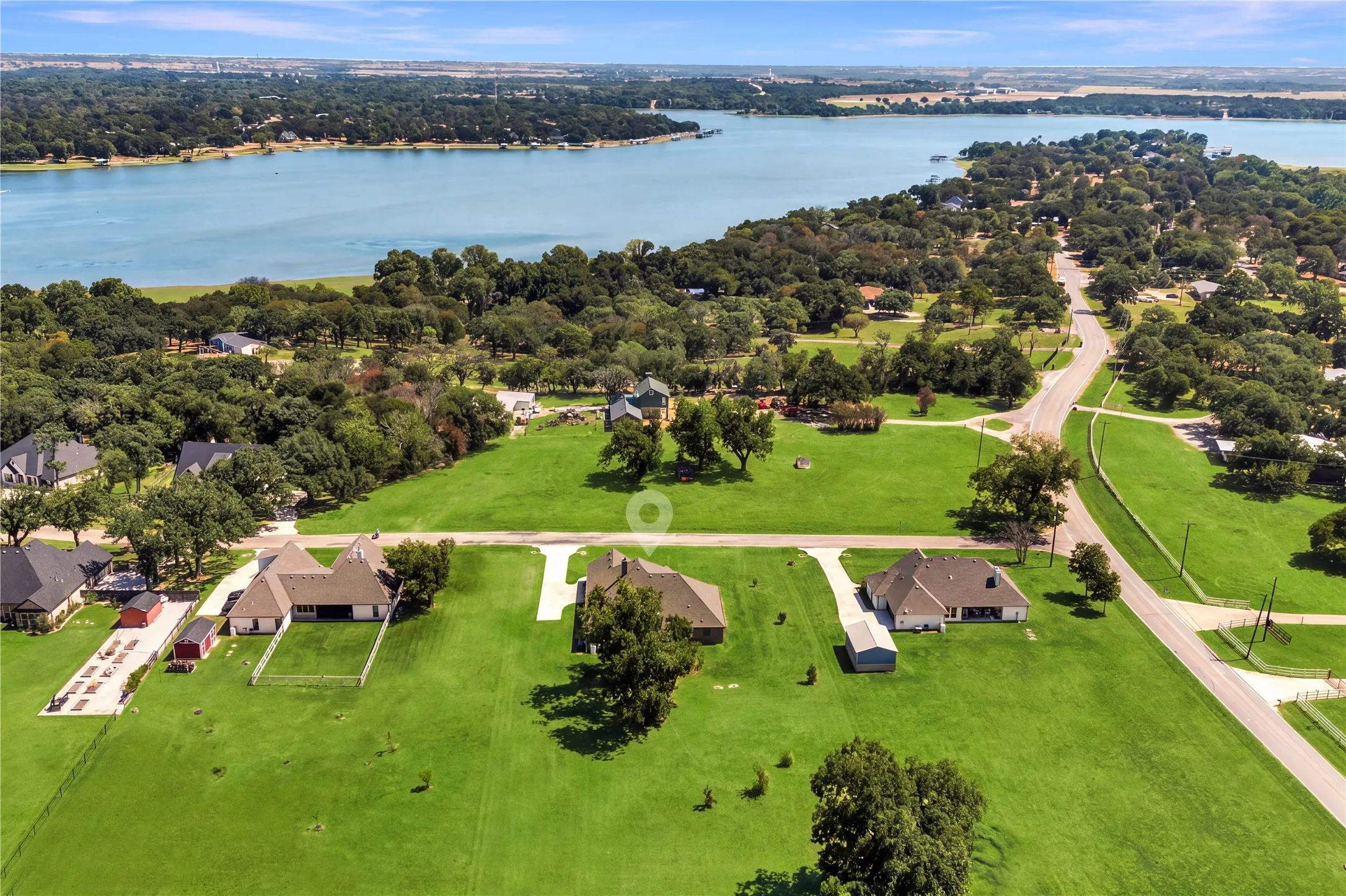 One acre setting within the cul-de-sac neighborhood of Deats Farm, where mature trees, open space and walks through the neighborhood can offer seasonal glimpses of the nearby lake through the canopy.
