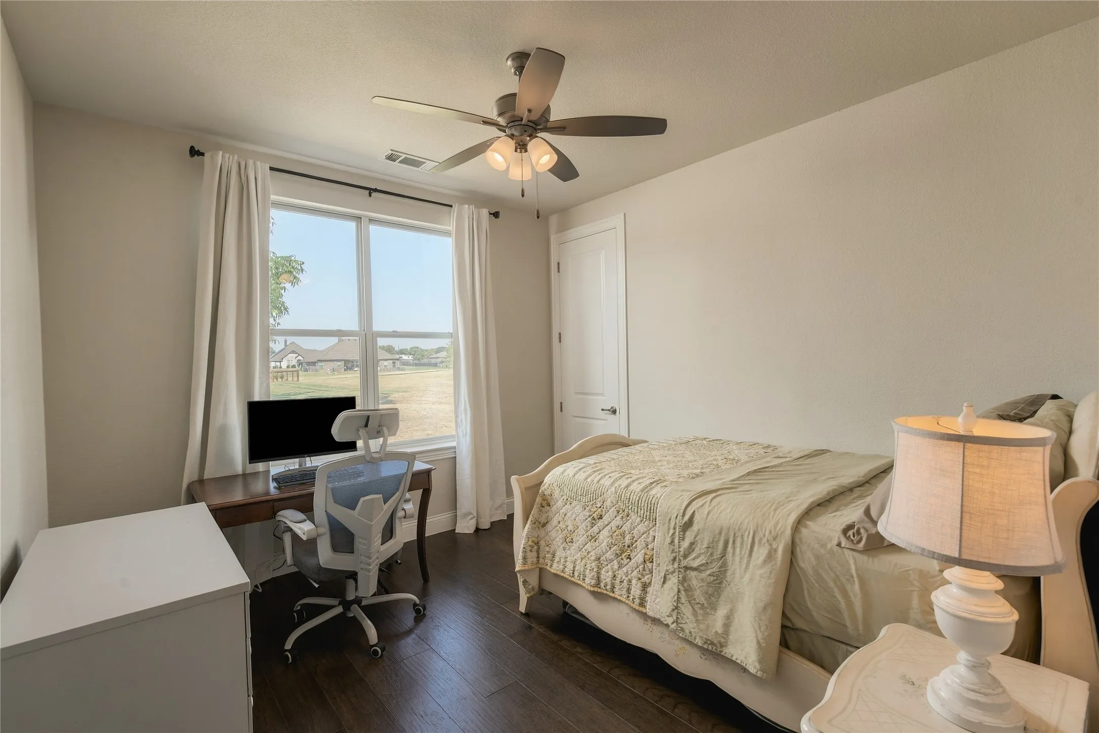 Another generously sized bedroom demonstrates the home's flexibility for family, guests, hobbies or an additional workspace.
