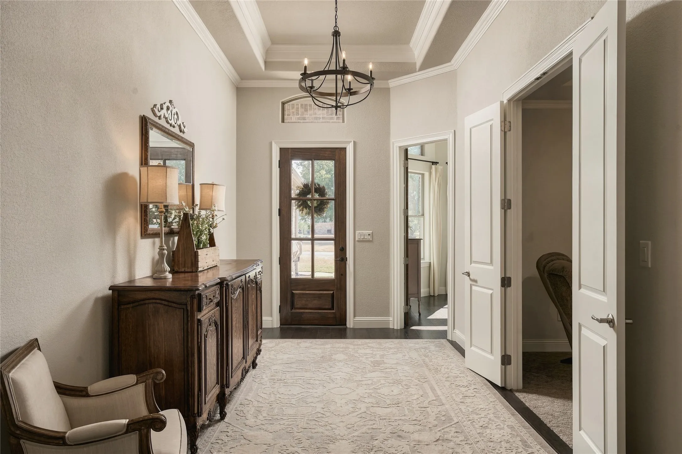 A thoughtfully finished interior blends hardwood floors, detailed millwork and architectural openings for a cohesive custom-home feel.