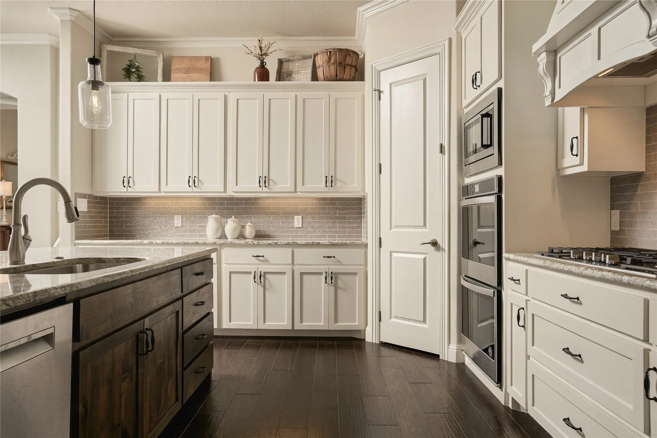 Thoughtful kitchen upgrades include soft-close cabinetry and updated hardware, adding a refined, quality feel to the extensive storage and workspace. Soft-close cabinetry continues into the bathrooms for a cohesive finish throughout the home.