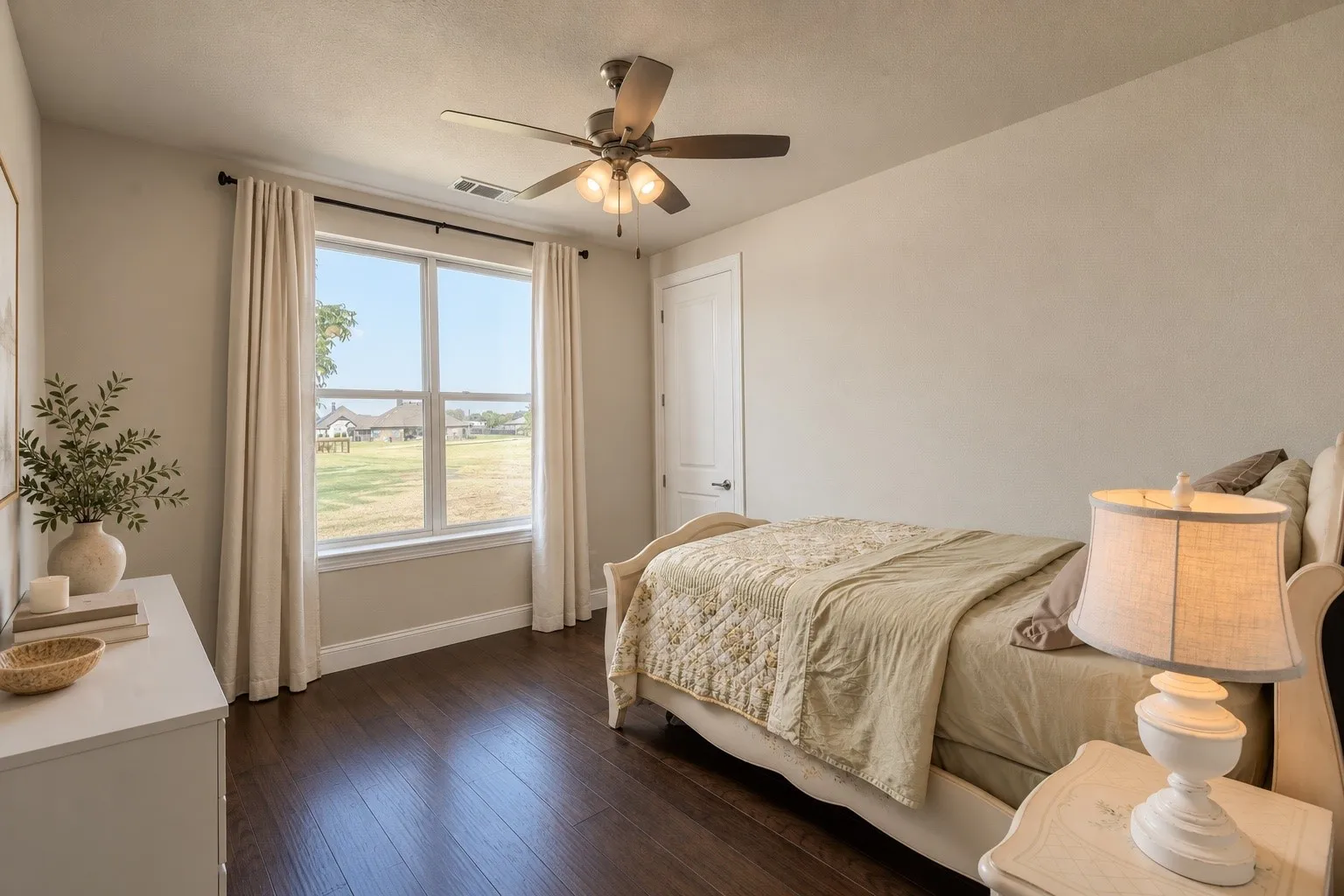 Another generously sized bedroom demonstrates the home's flexibility for family, guests, hobbies or an additional workspace.