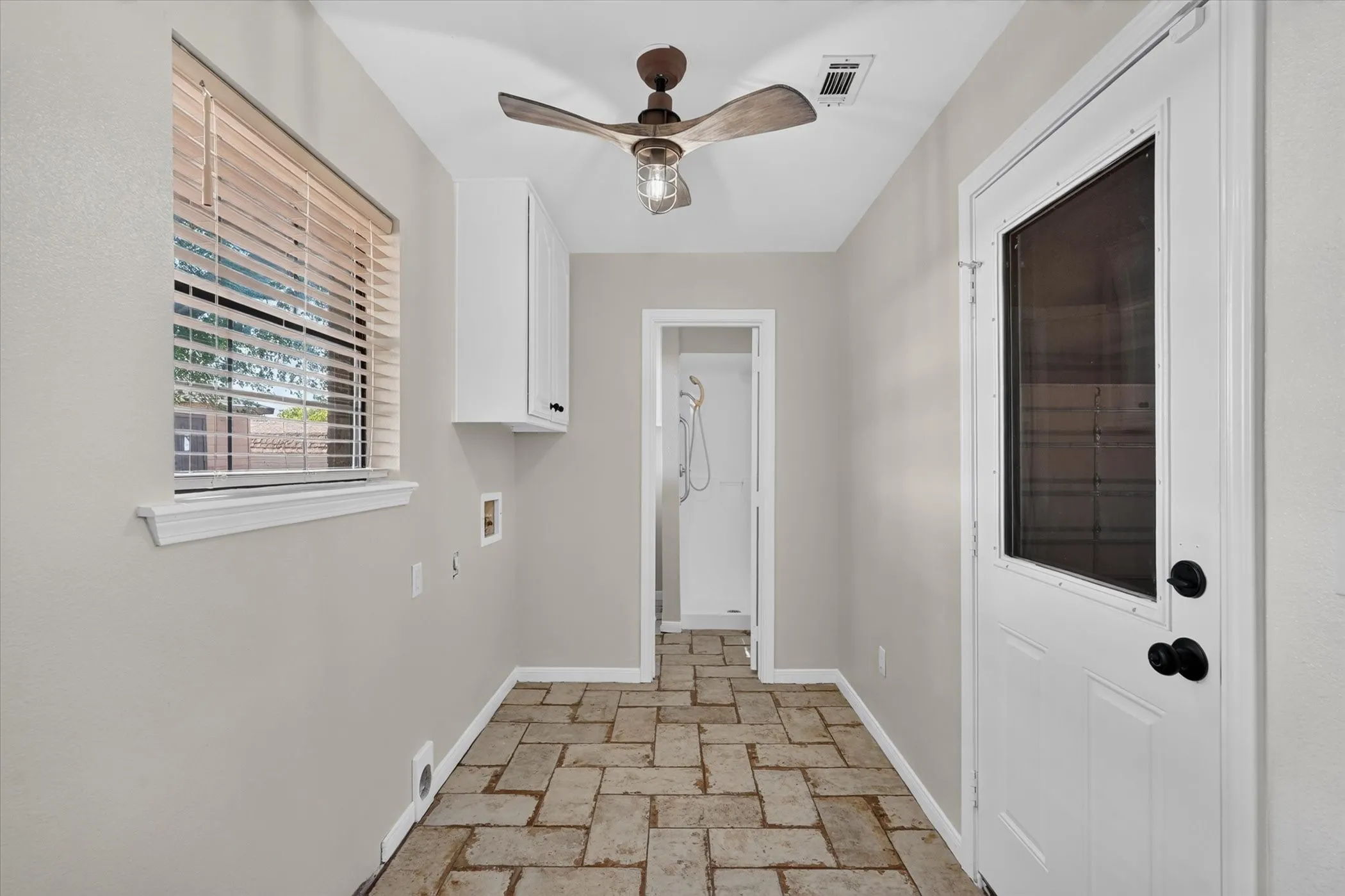 Recessed lighting, wood-finish ceiling fan, white cabinetry, light gray walls, and tile flooring
