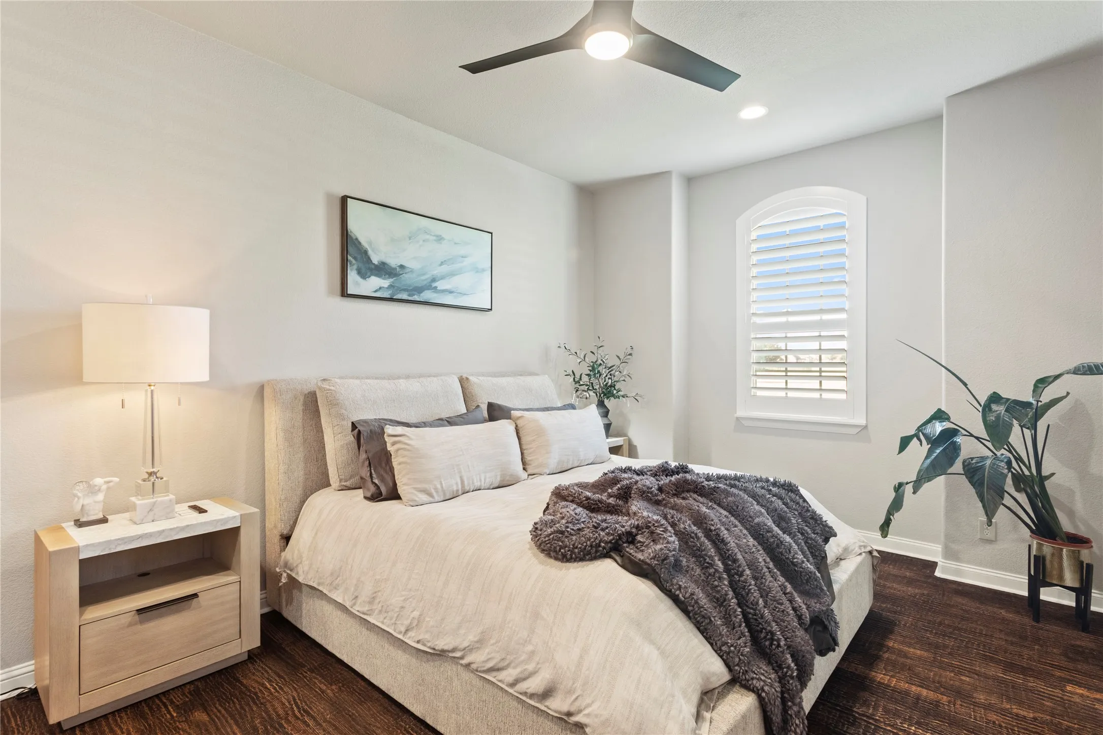 Wood-finish flooring, recessed lighting, and a ceiling fan with integrated lighting